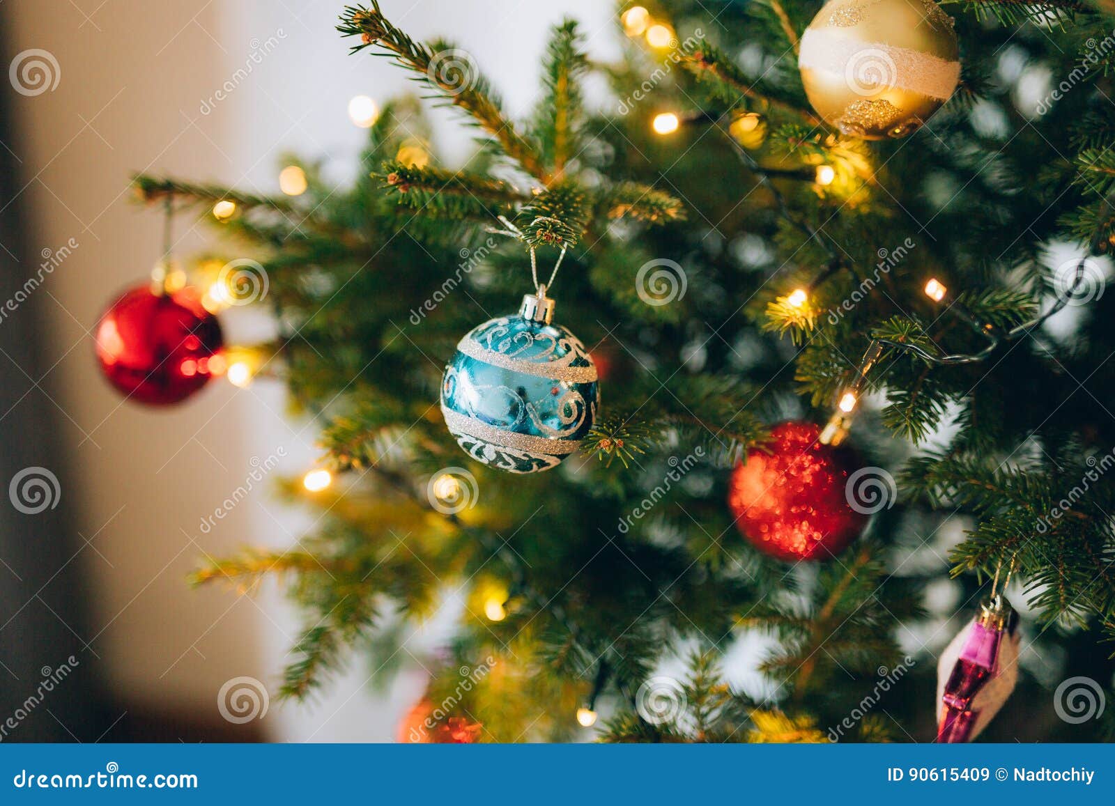 A Small Christmas Tree in a Pot, Decorated with Balls, Garlands Stock
