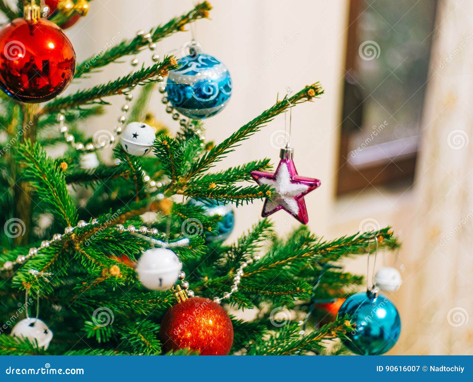 A Small Christmas Tree in a Pot, Decorated with Balls, Garlands Stock