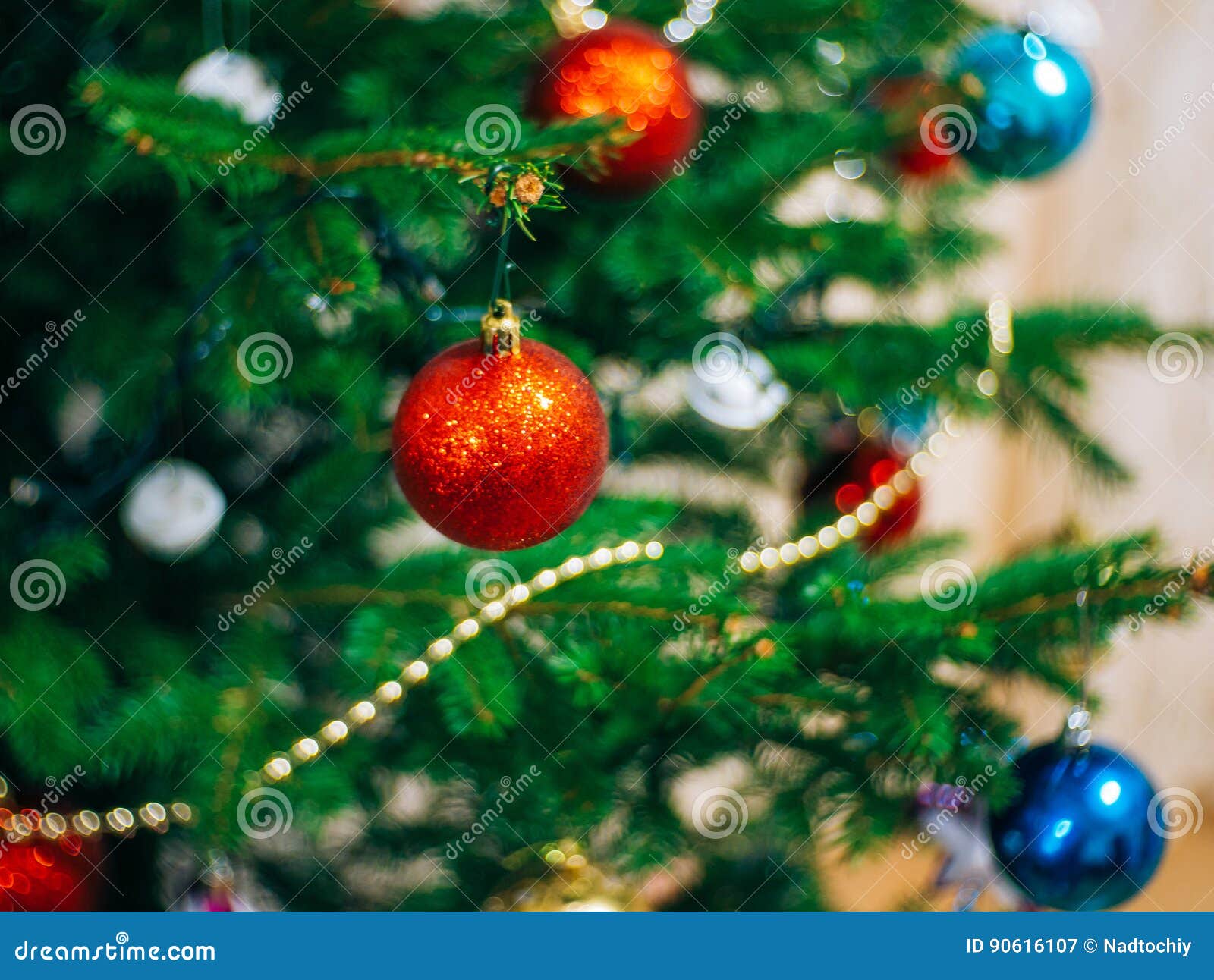 A Small Christmas Tree in a Pot, Decorated with Balls, Garlands Stock