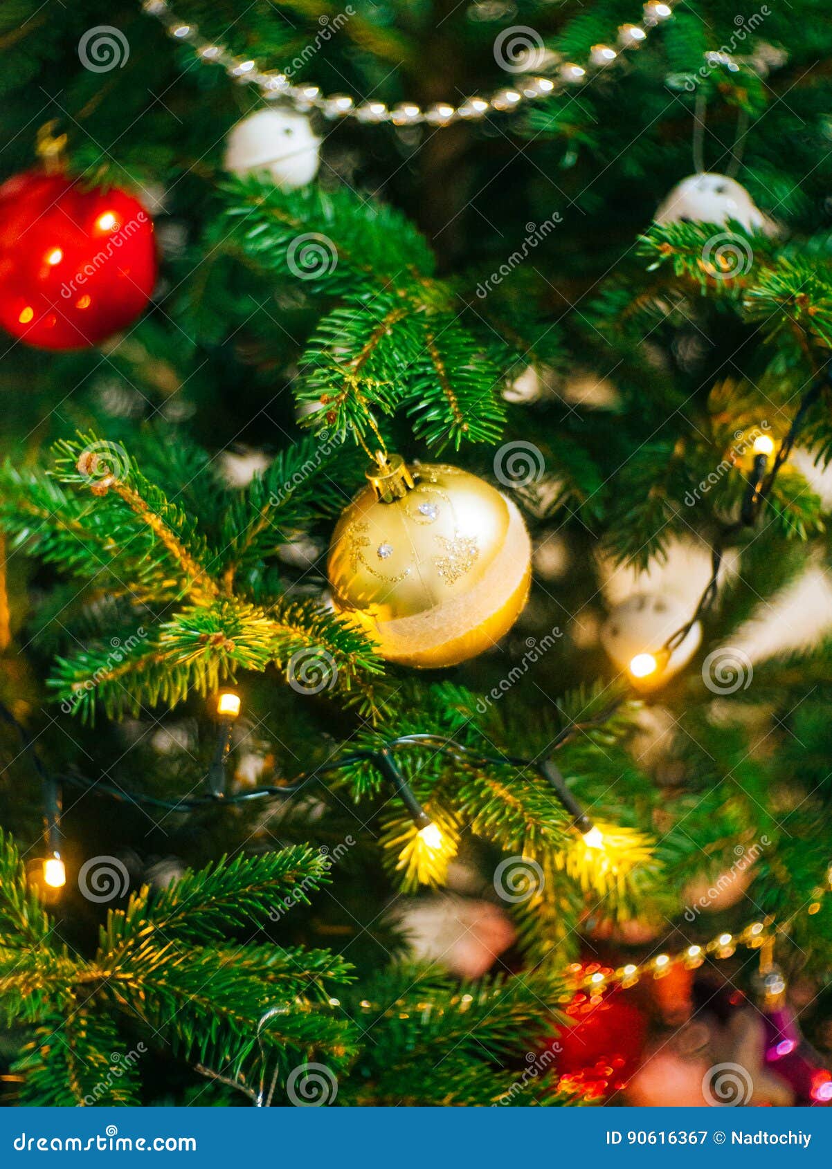 A Small Christmas Tree in a Pot, Decorated with Balls, Garlands Stock