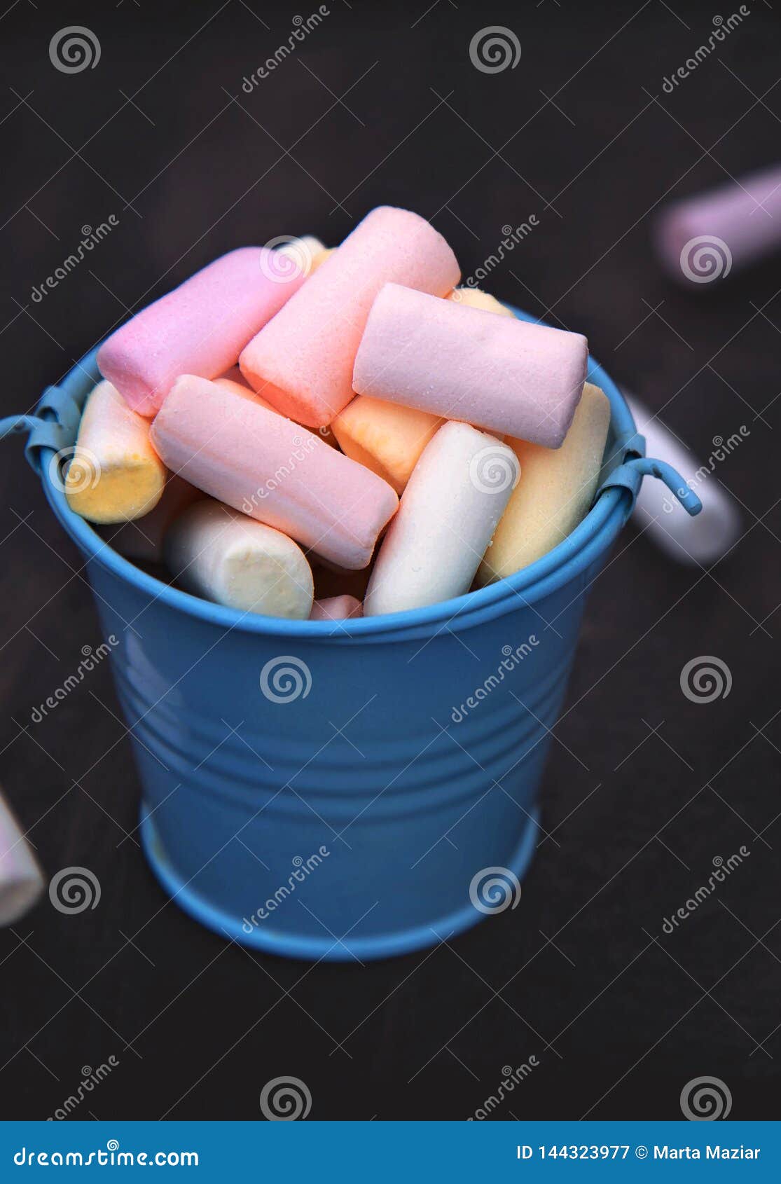 Small Colored Marshmallow in a Bucket on a Dark Background Stock Image