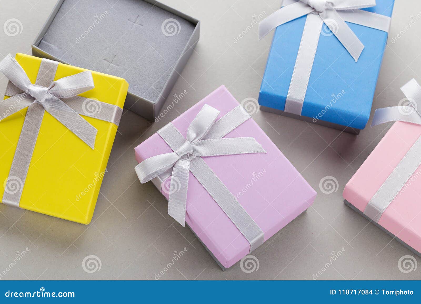 Small Colorful Jewelry Gift Boxes with Bows on Gray Background Stock ...