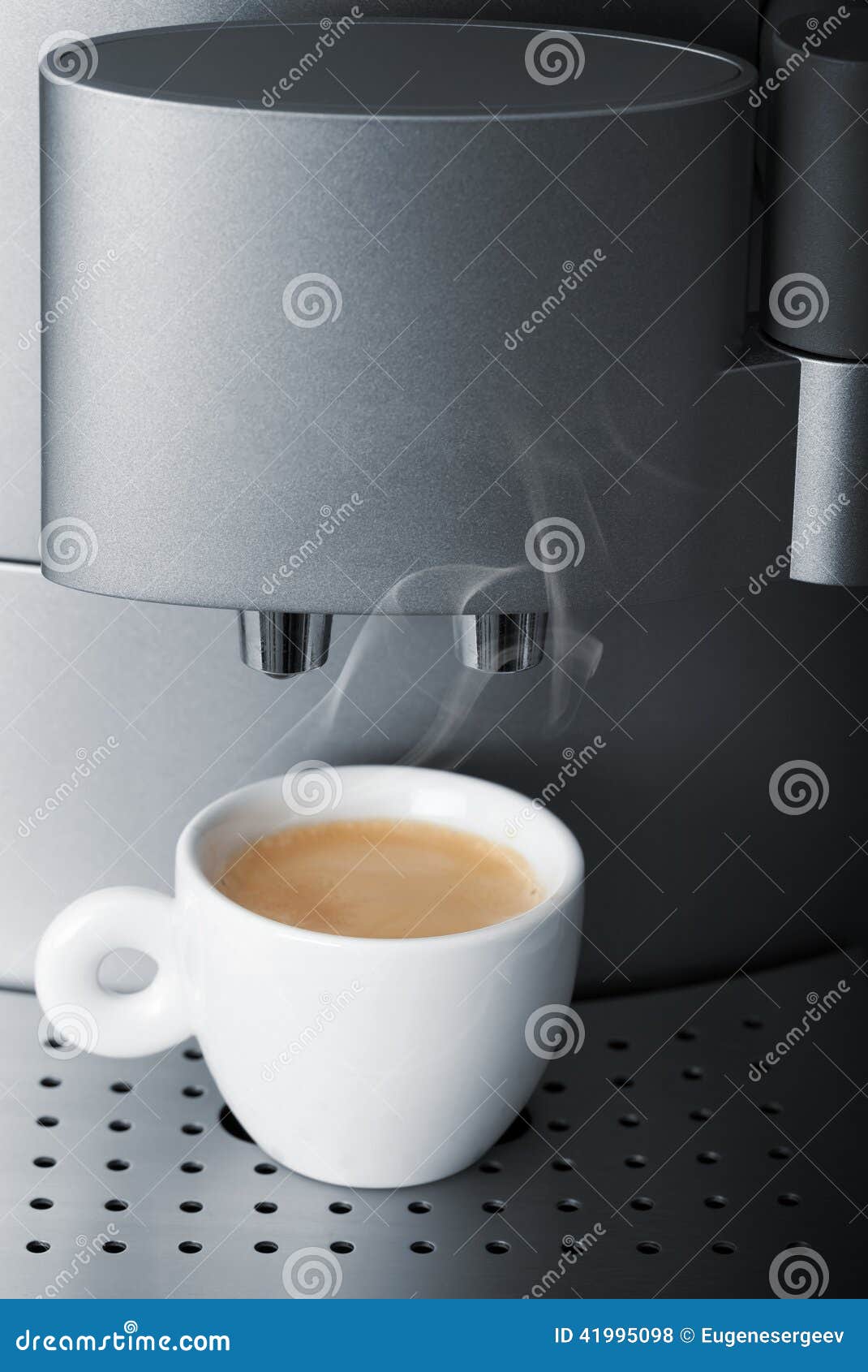 Small Cup of Hot Espresso in Automatic Coffee Machine Stock Photo