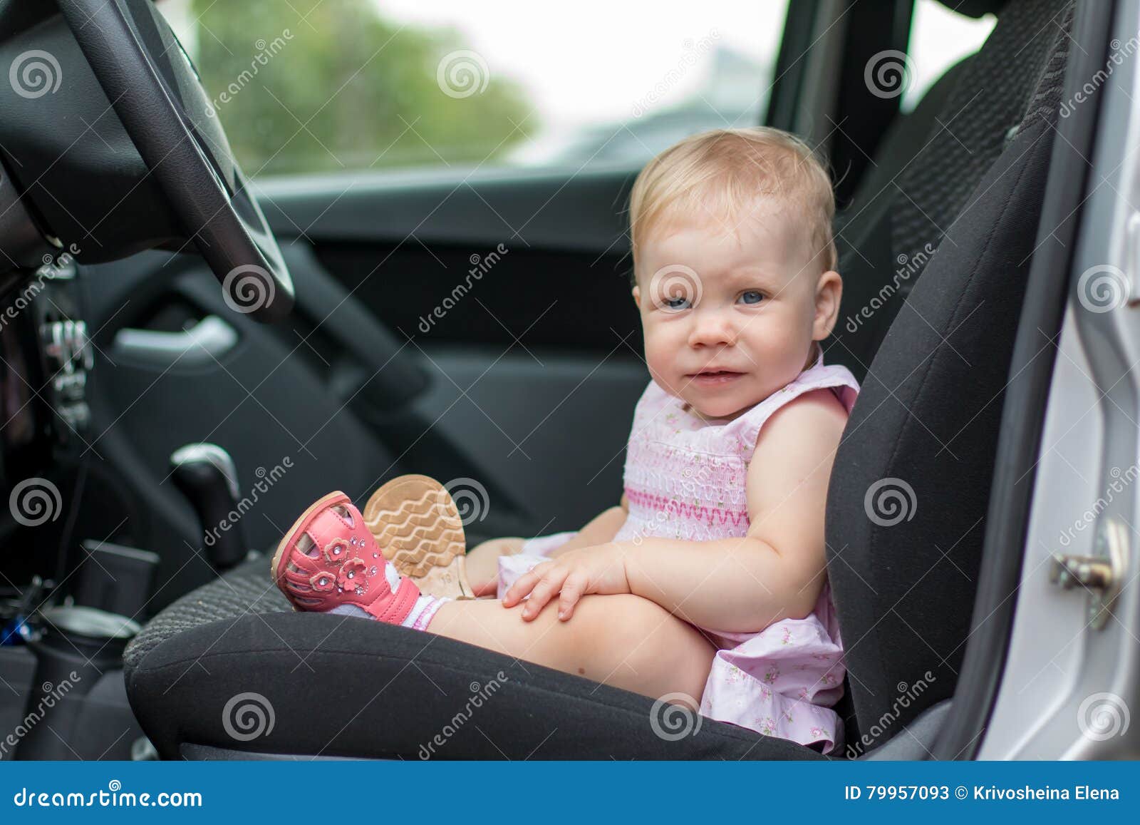 Small cute baby in a car stock image. Image of summer 79957093