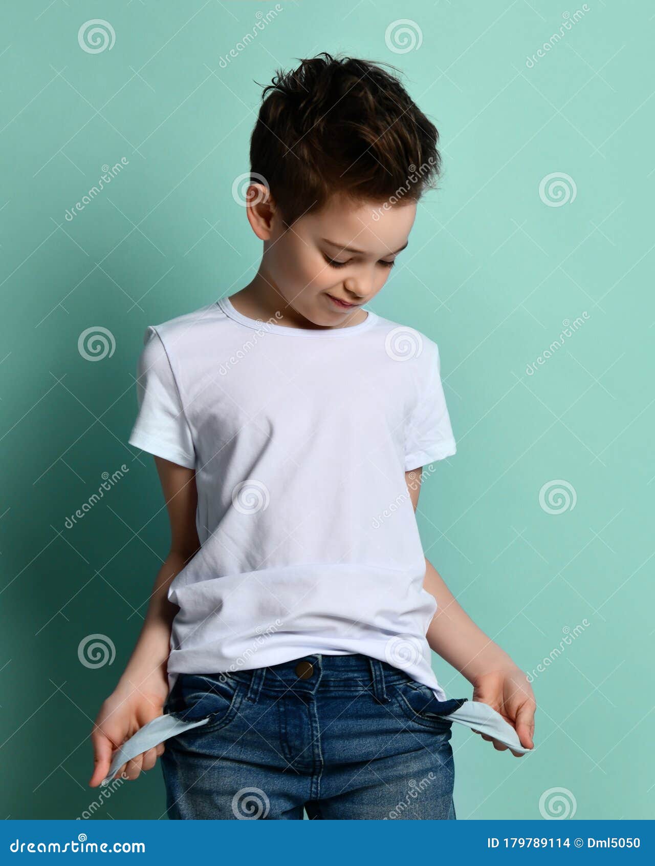 Small Cute Boy with Modern Hairstyle in Stylish Casual Clothing Standing  and Showing Empty Pockets with No Money Concept Stock Photo - Image of  credit, jeans: 179789114