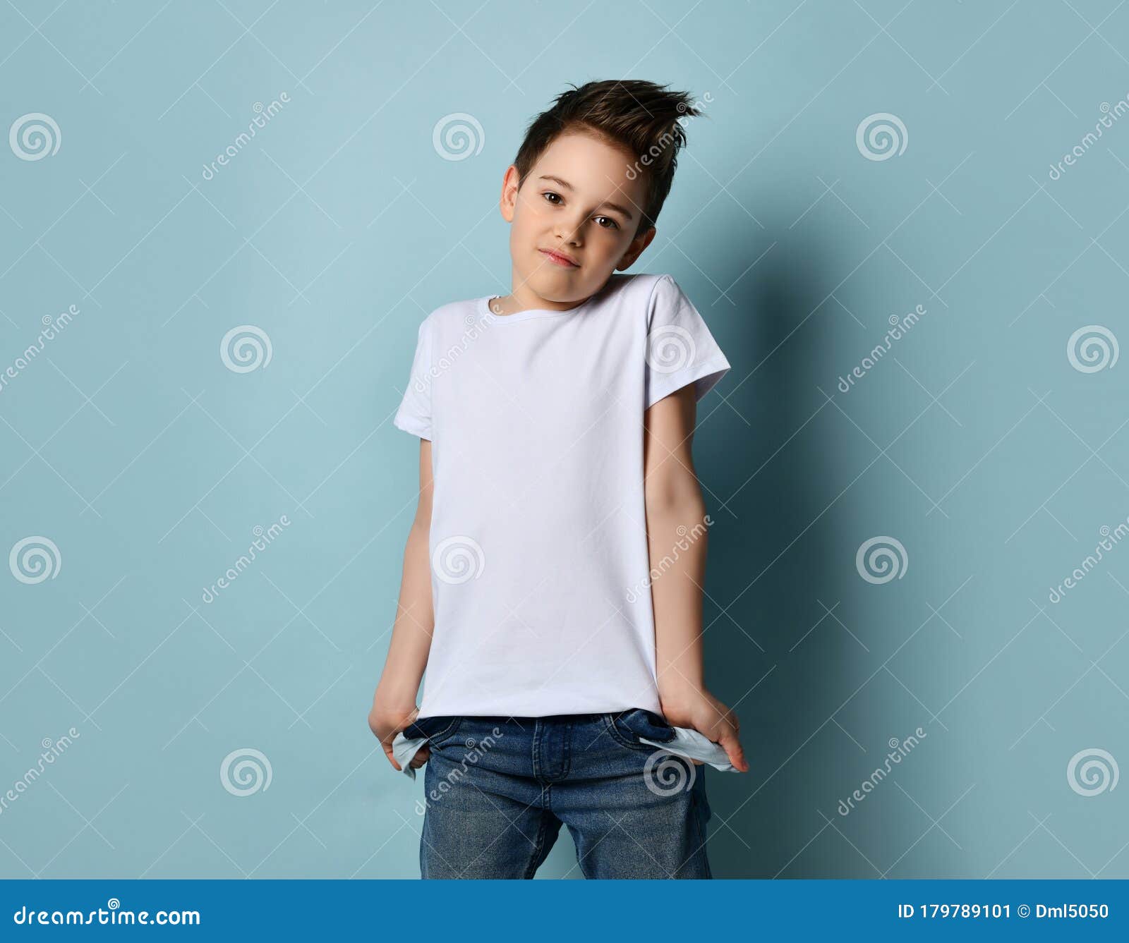 Small Cute Boy with Modern Hairstyle in White T-shirt Standing and Showing  Empty Pockets with No Money Concept Stock Image - Image of lost, lifestyle:  179789101