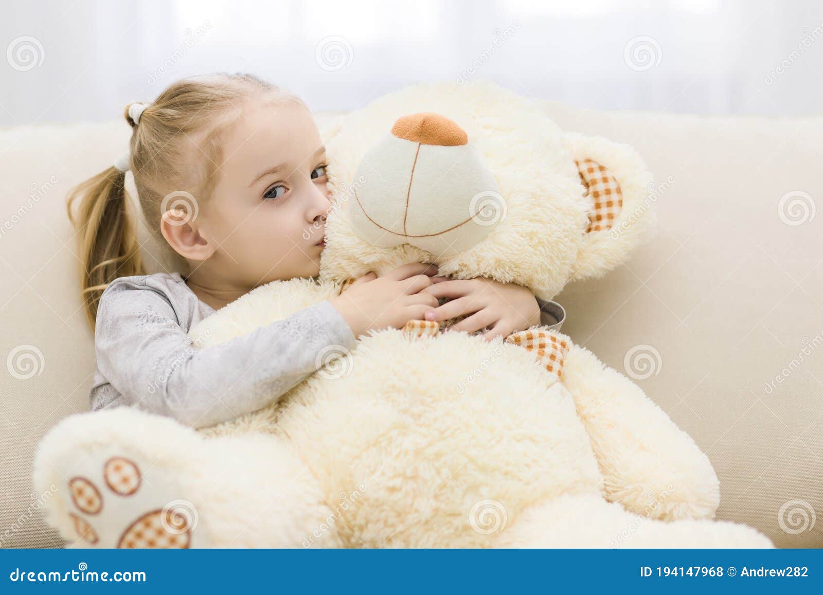 Small Cute Girl Kisses White Toy Bear on Close Up Photo. Stock Photo ...