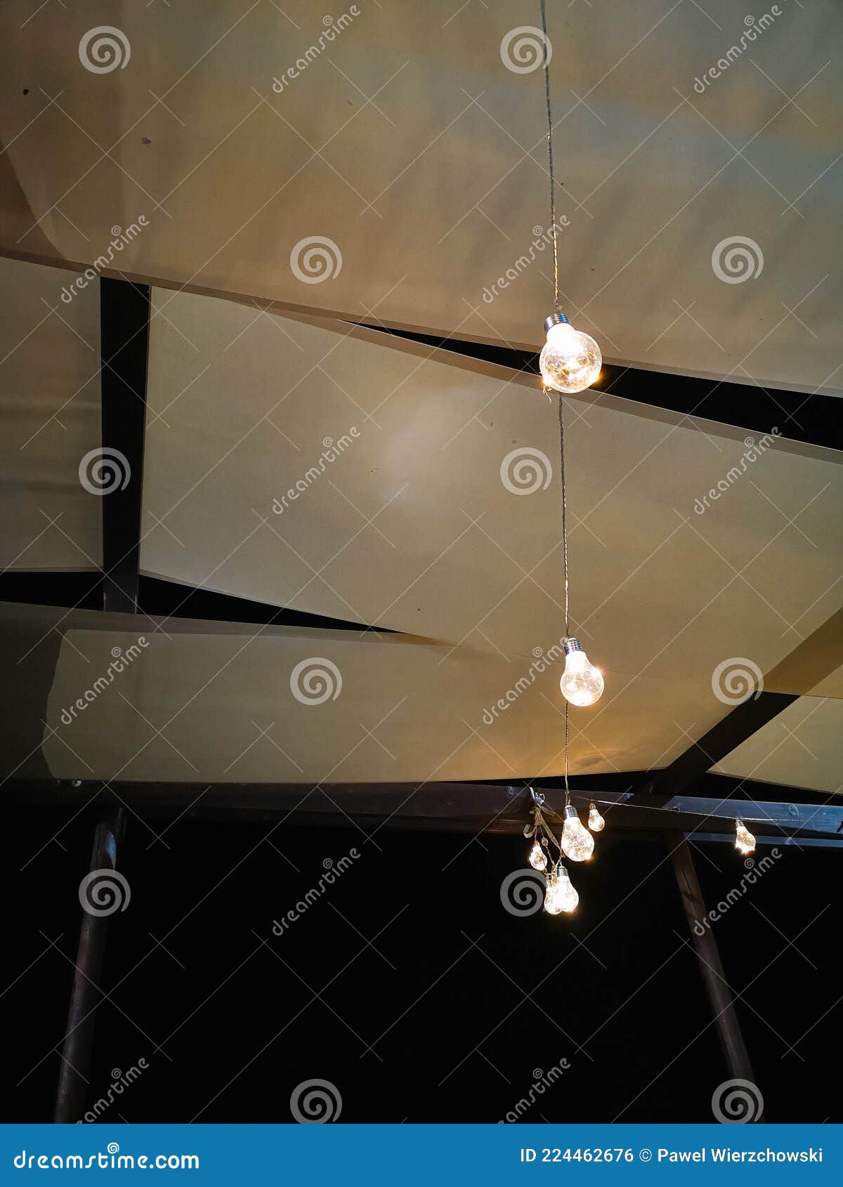 Small Decorative Bulbs Hanging Under Small Roof of Bower Stock Photo