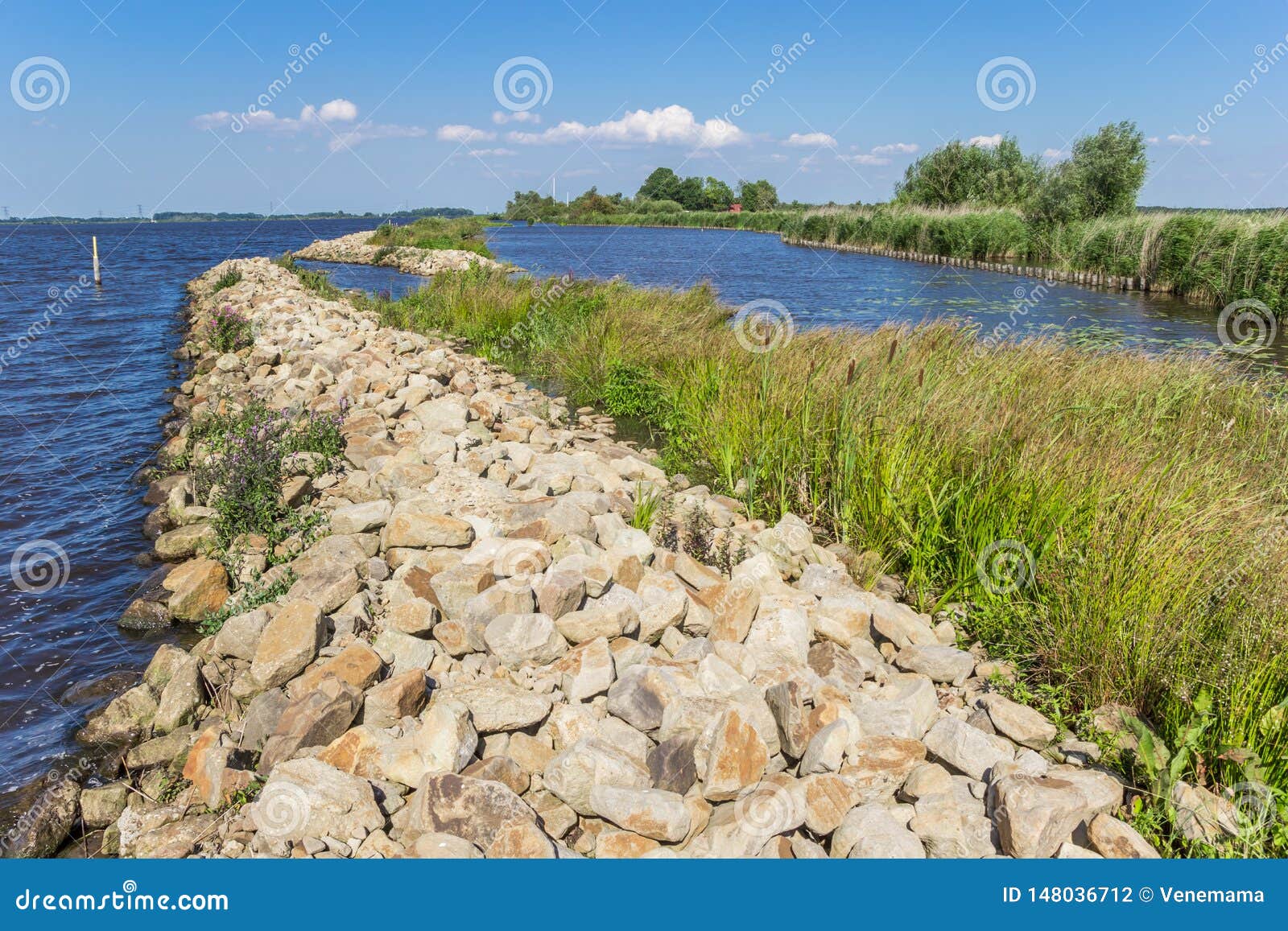 small dike at the schildmeer lake in groningen