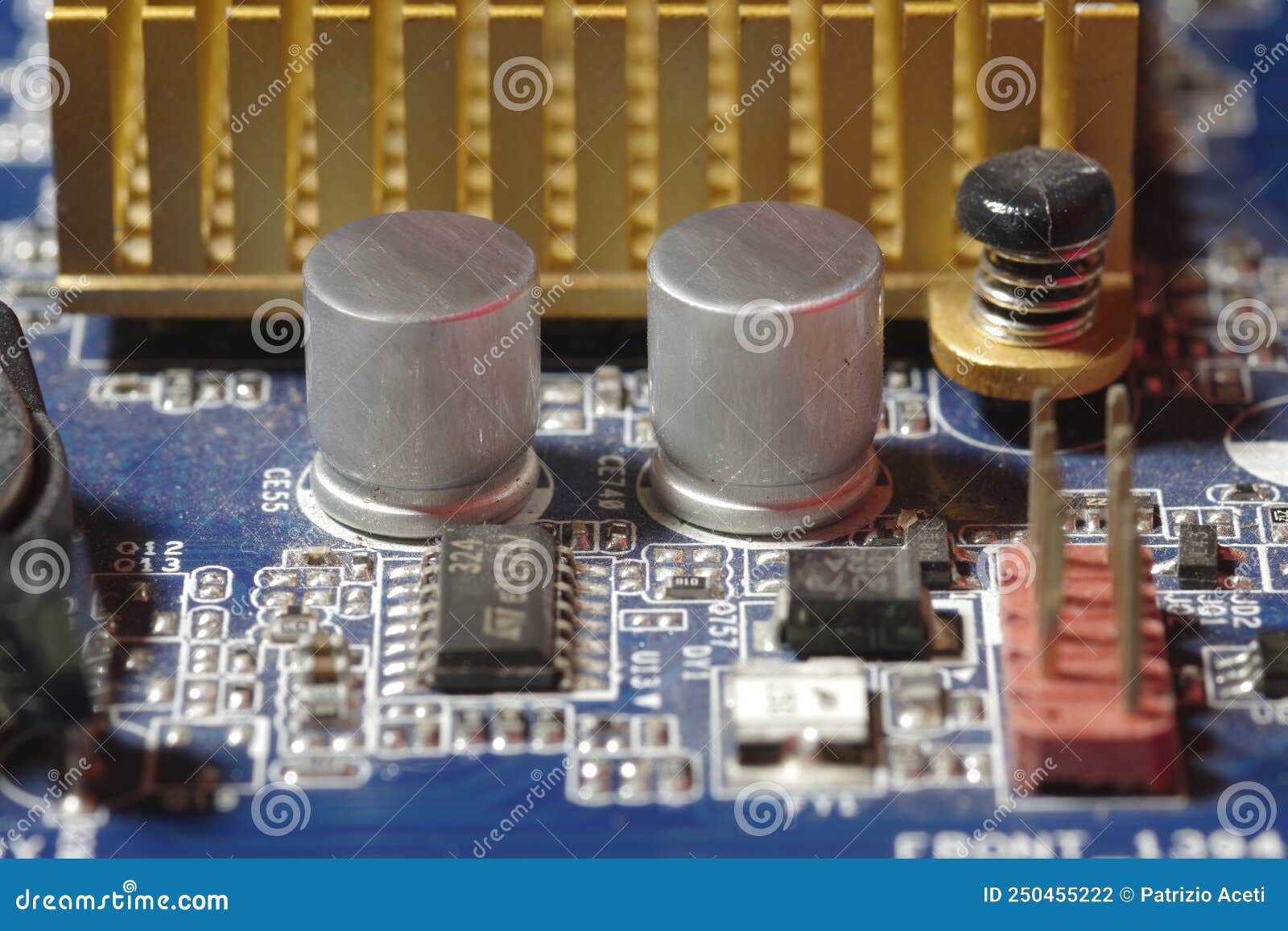 Small Electronic Components on Top of a Motherboard Stock Photo Image