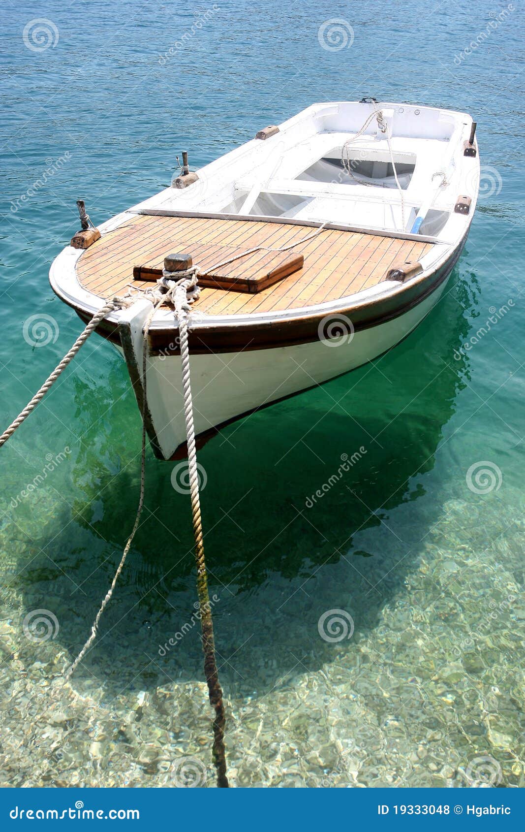 old wooden boat dock, going far out to sea. stock photo
