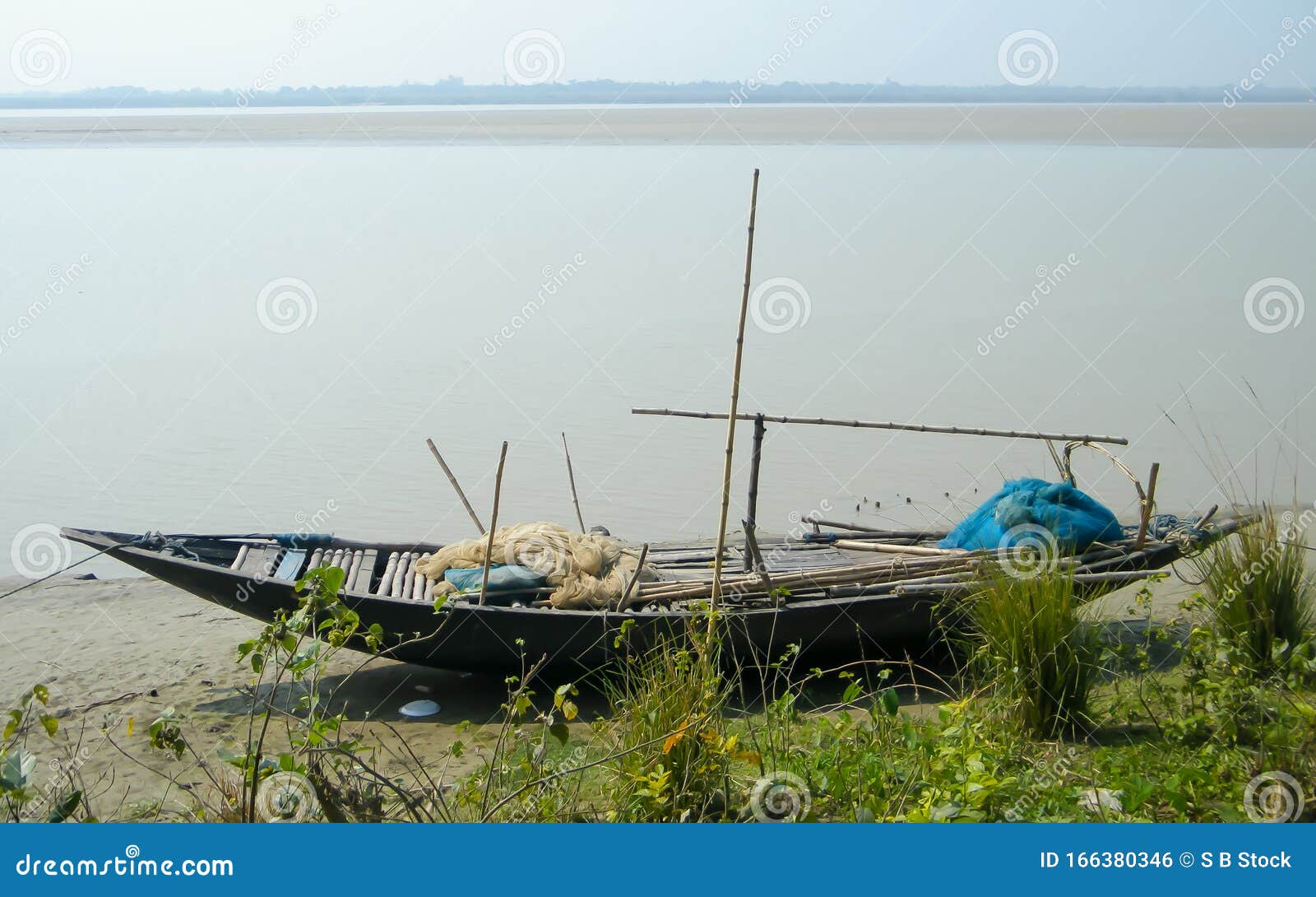 A Small Fishing Boat Nautical Vessel with Commercial Fishing Net on Ganges  Riverside Near Coastal Area of Bay of Bengal. Late Stock Photo - Image of  basin, finance: 166380346