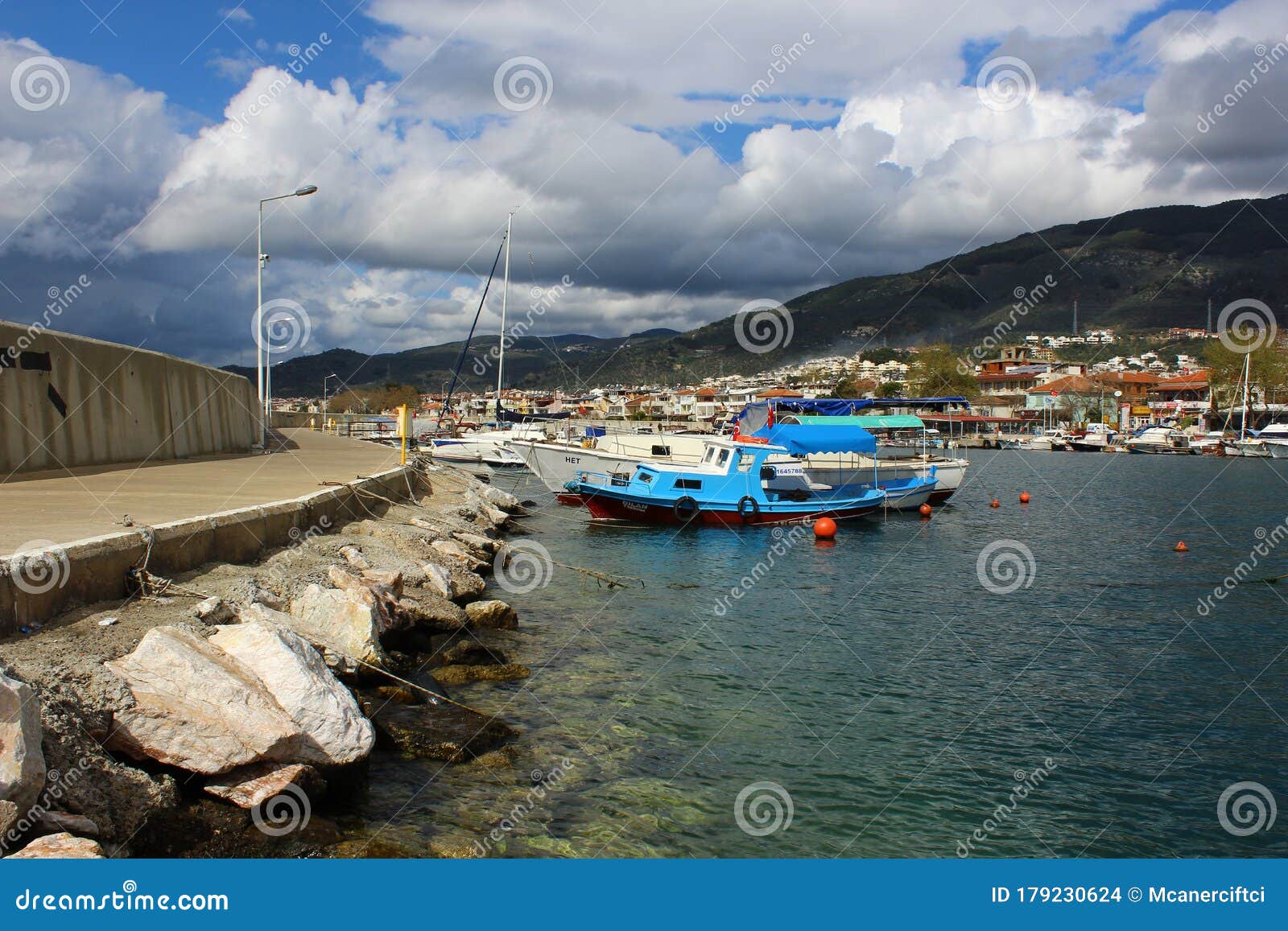 Small Fishing Boats and Yachts in the Altinoluk Port. Tourist Cafe ...