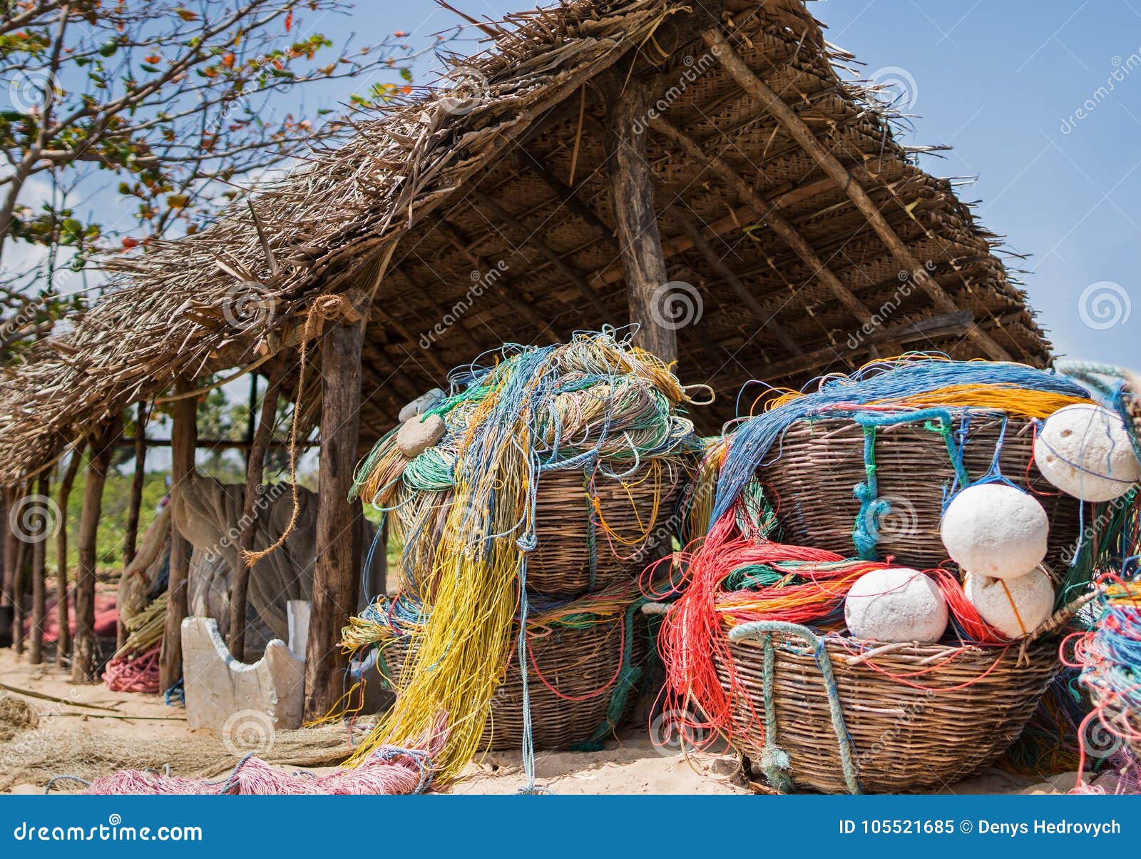 https://thumbs.dreamstime.com/z/small-fishing-hut-beach-color-net-floats-nylon-rope-used-industry-big-wicker-baskets-105521685.jpg