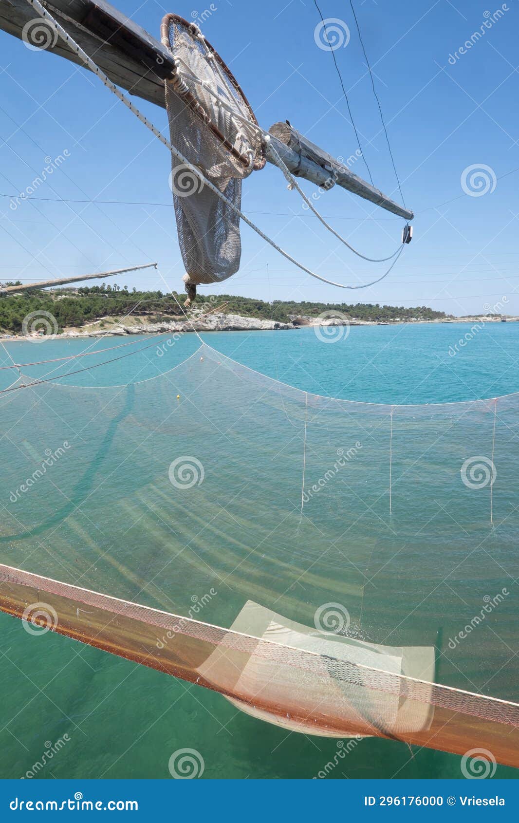 Small Fishing Net Hangs from a Wooden Mast of a Traditional