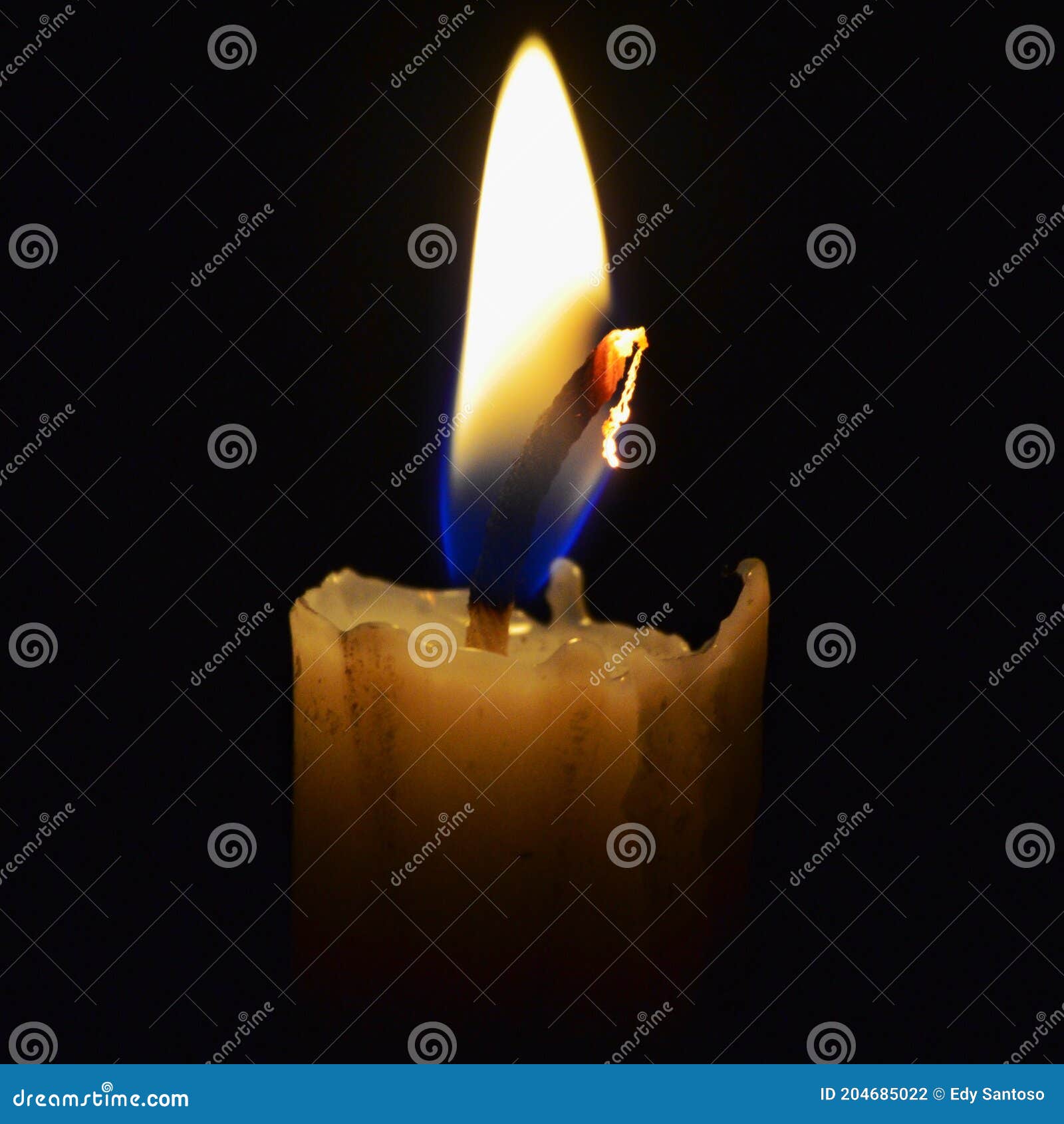 Small Flame from a candle stock photo. Image of small 204685022