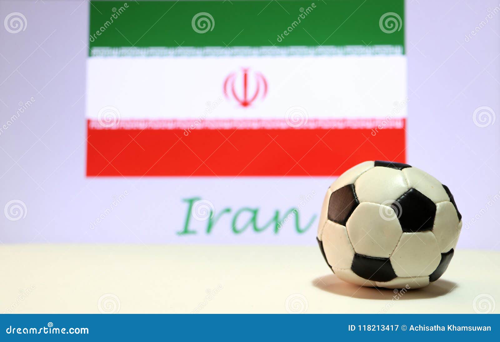 Small Football on the White Floor and Iranian Nation Flag with the Text ...