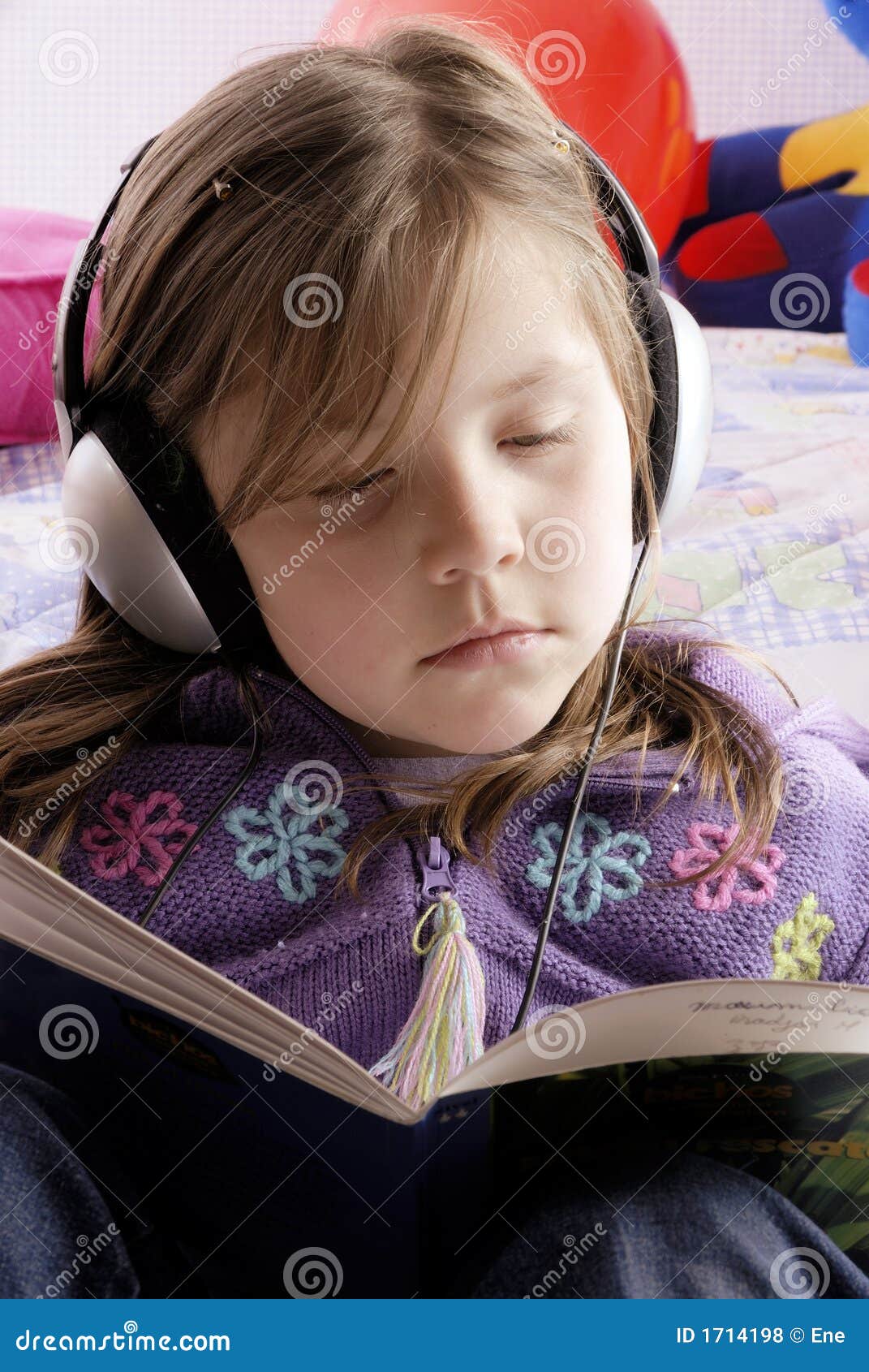 small girl with headphones