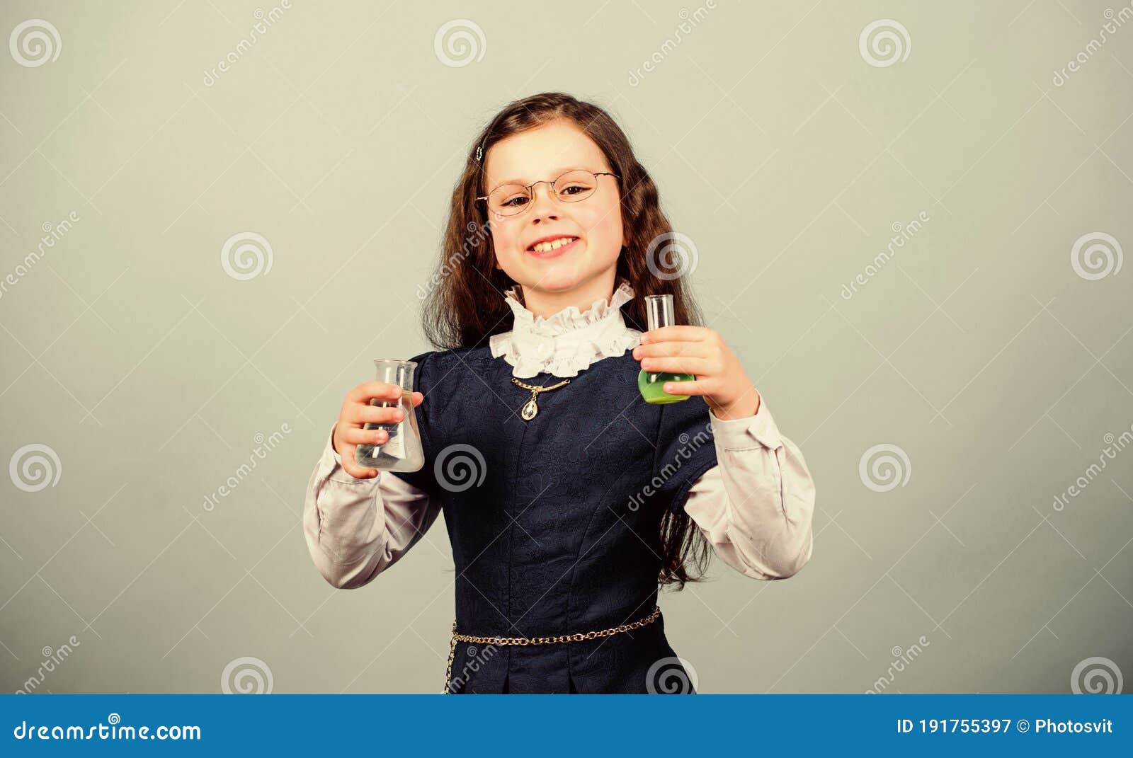 small girl scientist with testing flask. back to school. education and knowledge. child study bilogy lesson. discover