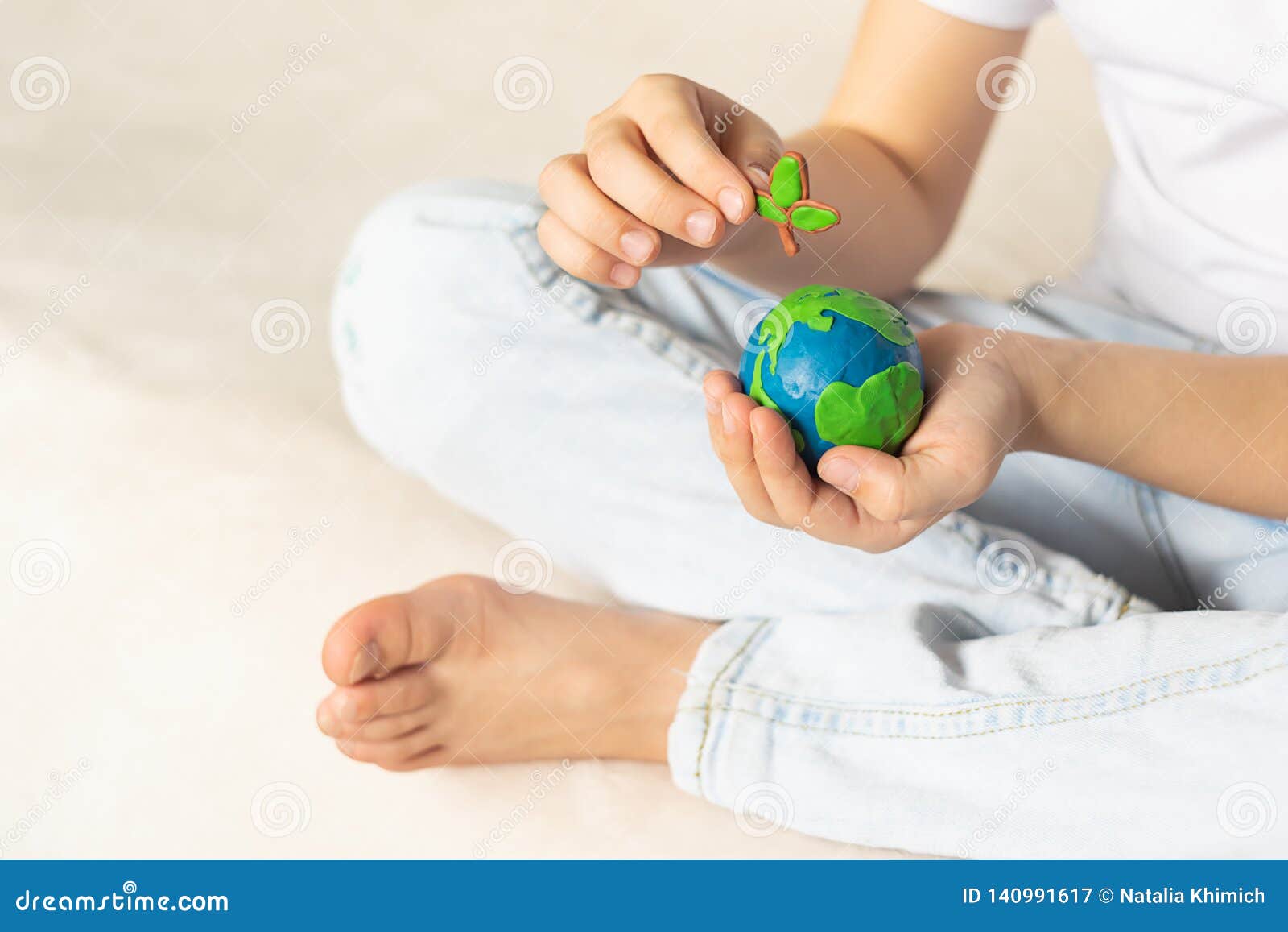 Child Hands Holding Earth Model Clay Rainbow Ecology Concept Top Stock  Photo by ©galiaromaniv88@gmail.com 489952540