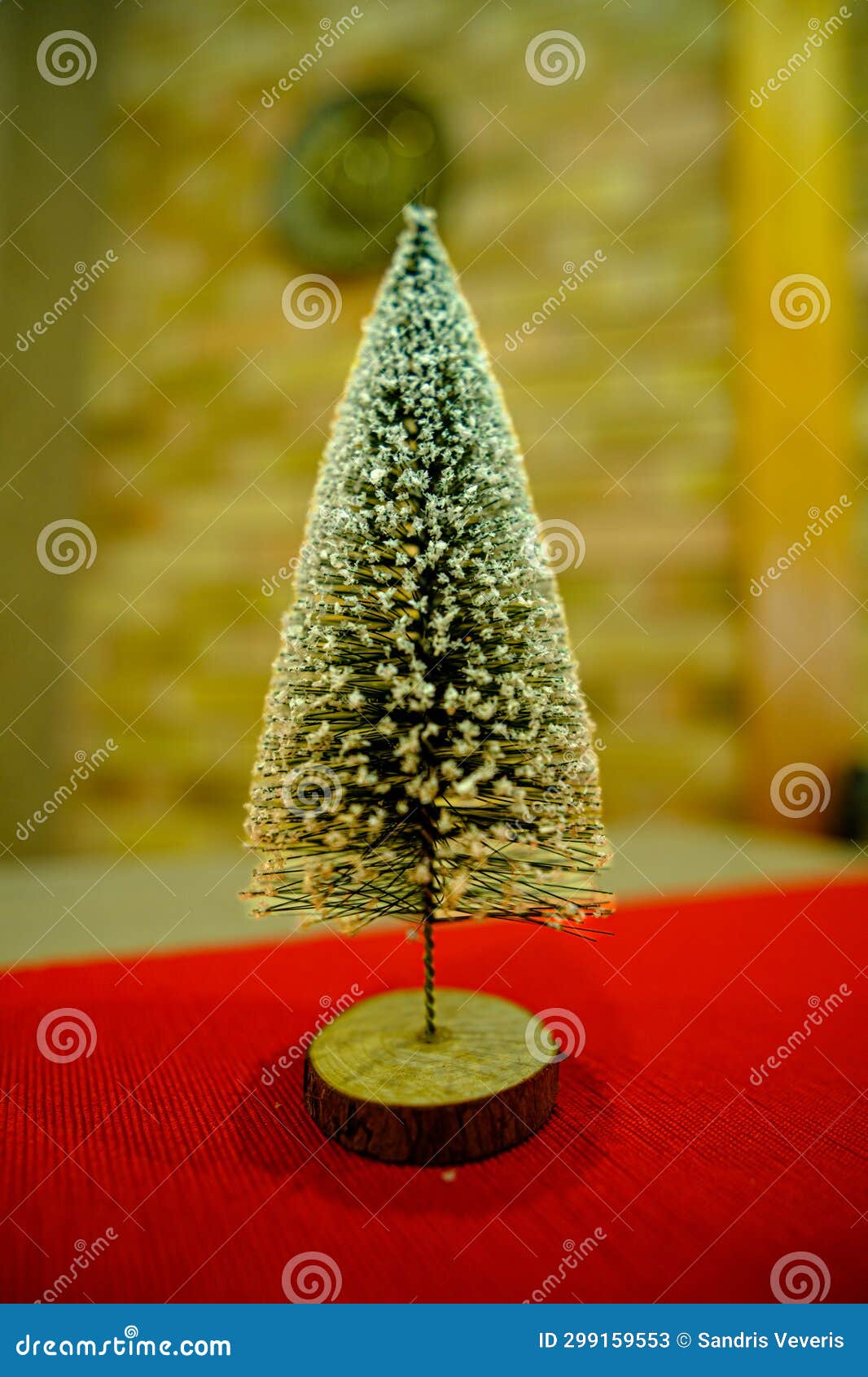 A Small Green Christmas Tree on the Table. a Small Christmas Tree
