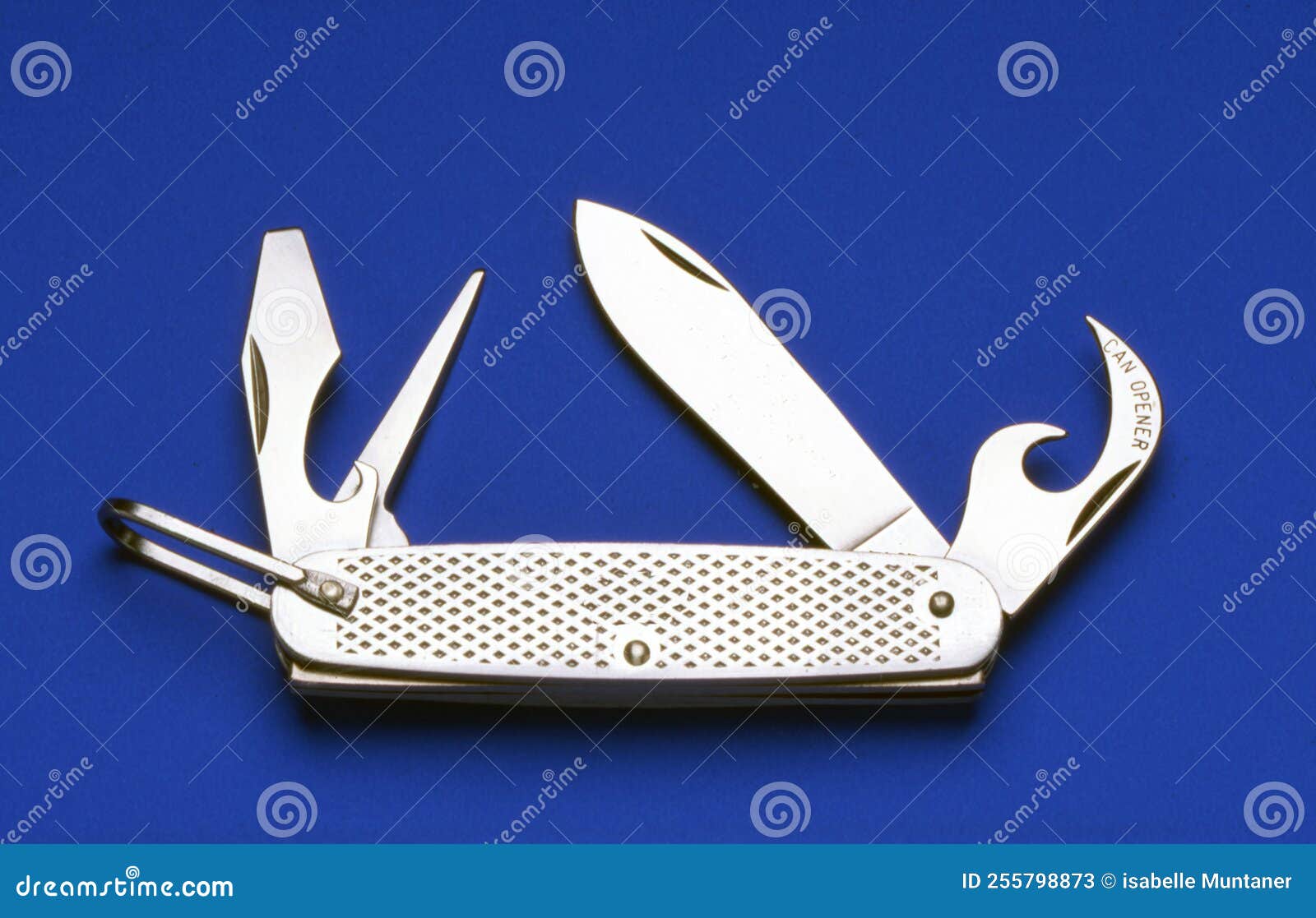 Small Handy Multipurpose Penknife on a Blue Background Stock Image