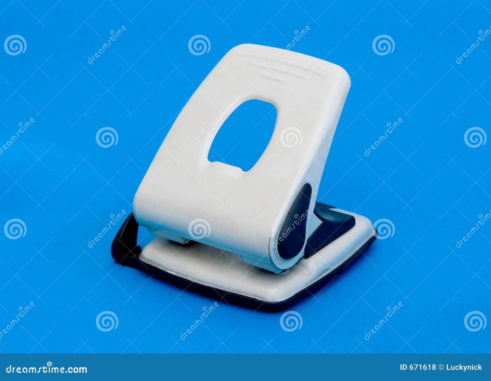 small hole puncher on blue
