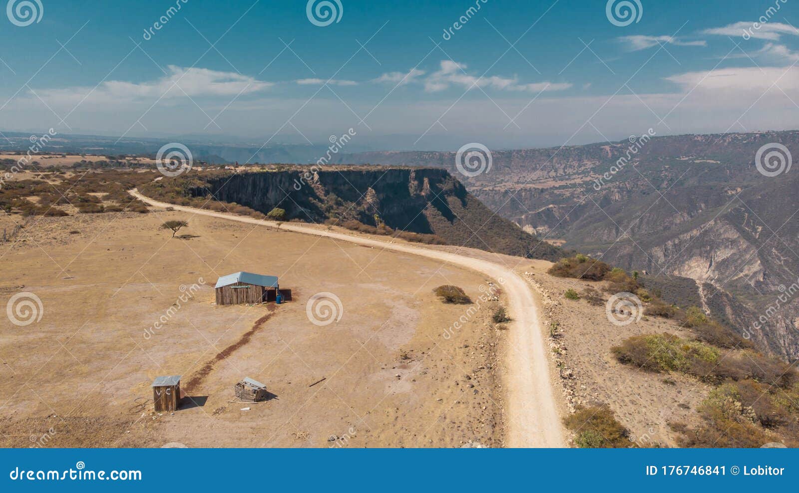 small house in the middle of the desert next to the a cliff in peÃÂ±a al aire libre state of hidalgo