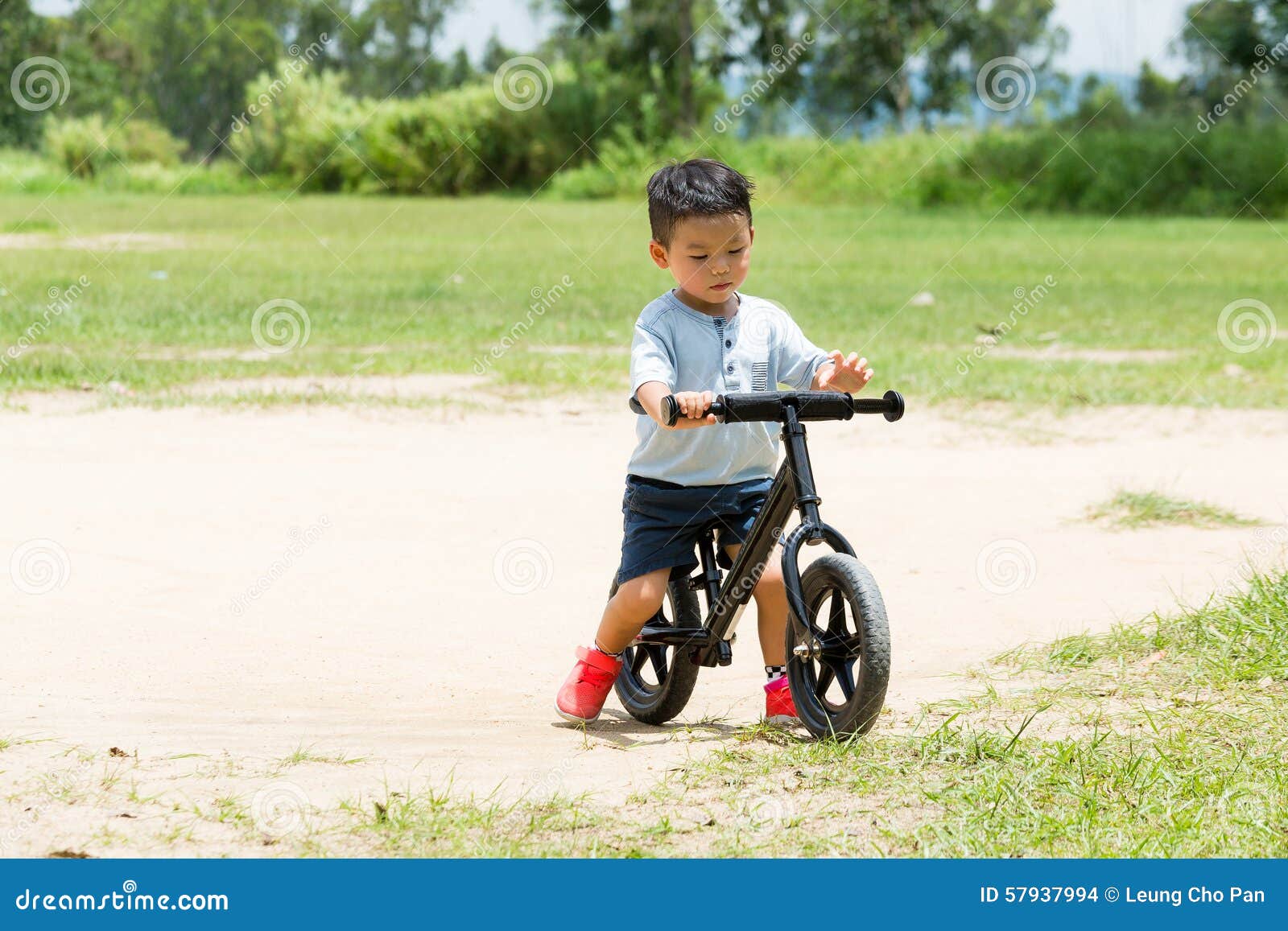 small boy riding bike