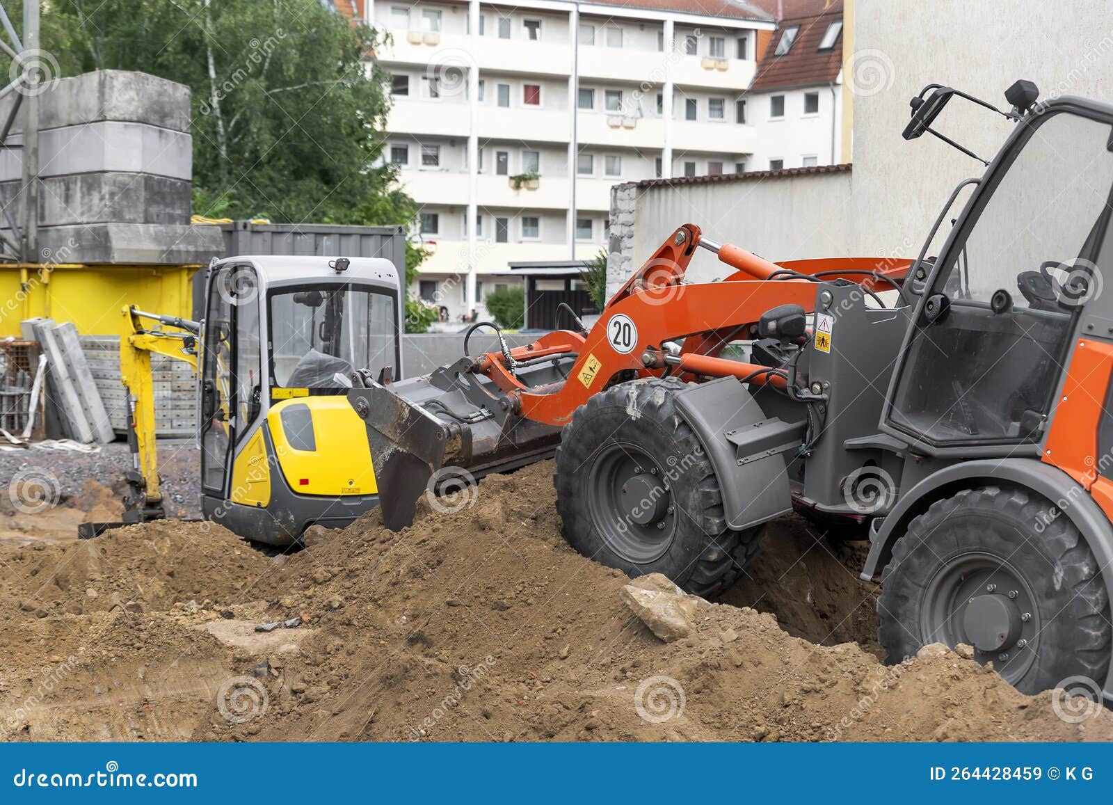 Small Loader and Excavator Digger Machine Moving Heap of Earth and Debris  Rubble at Construction Site. New Building Stock Image - Image of mover,  house: 264428459