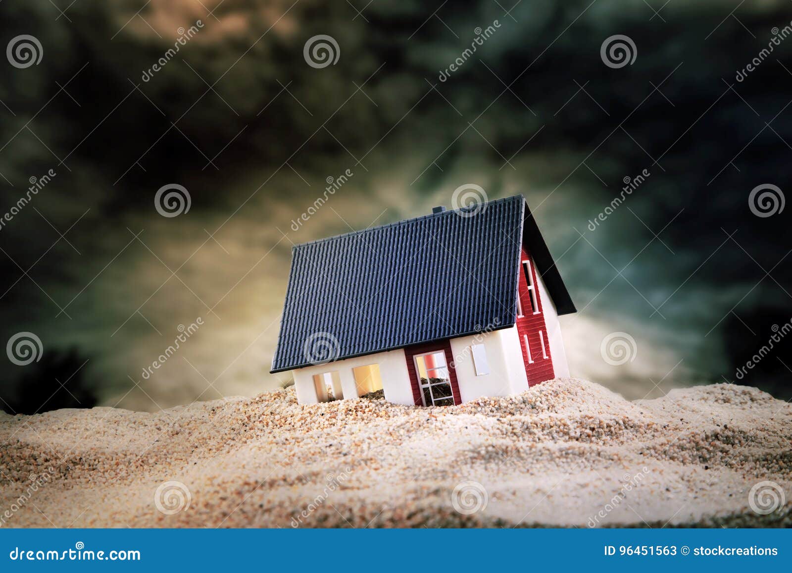 small model of house in sand