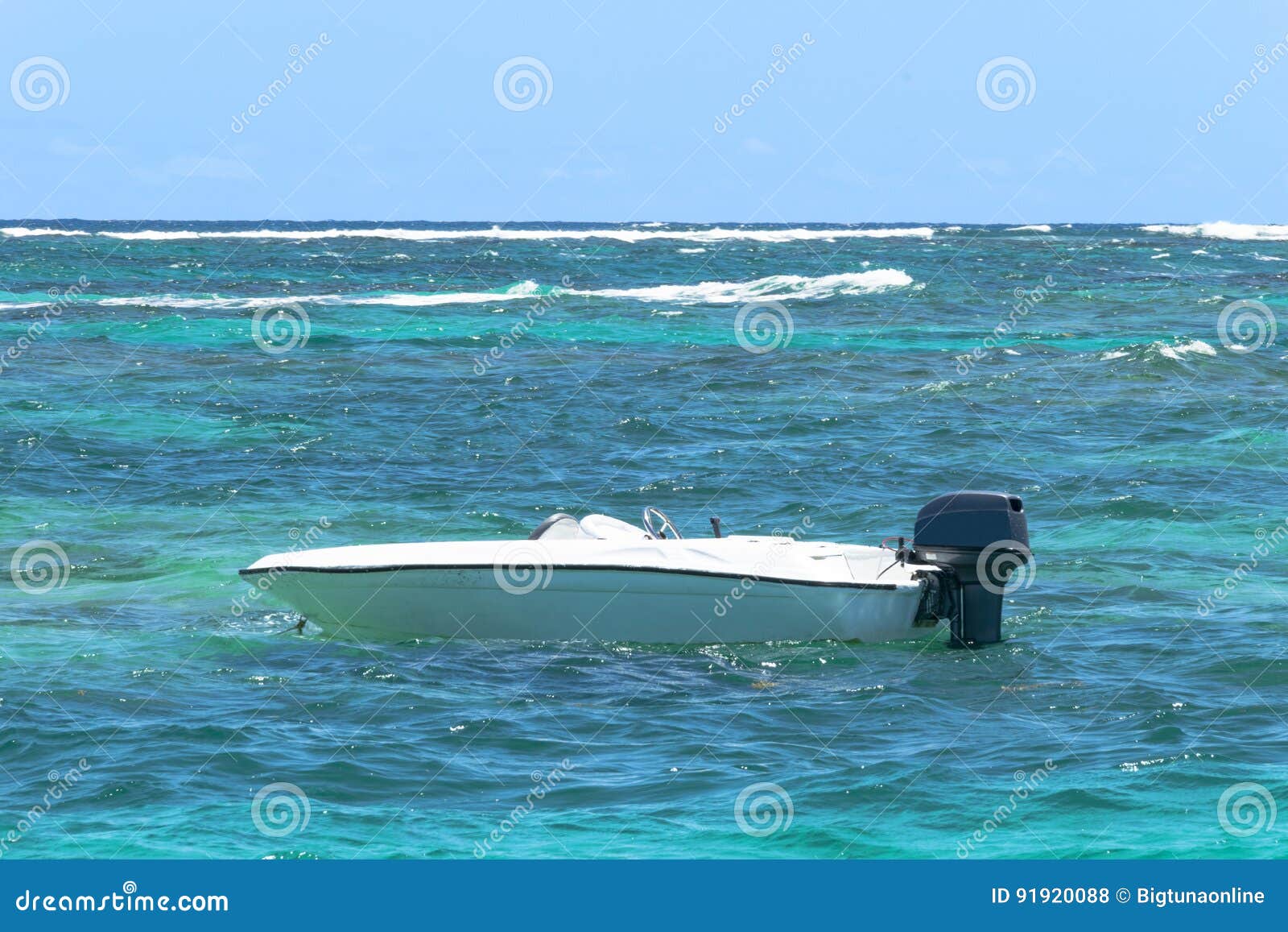 Small Motor Boat Sailing on the Big Turquoise Ocean with Waves. Stock
