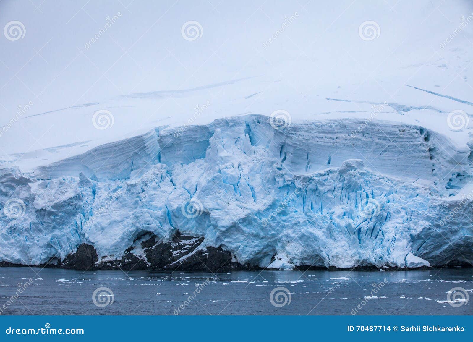 Small Part of the Blue Larger Iceberg in Ocean, Antarctica Stock Photo ...