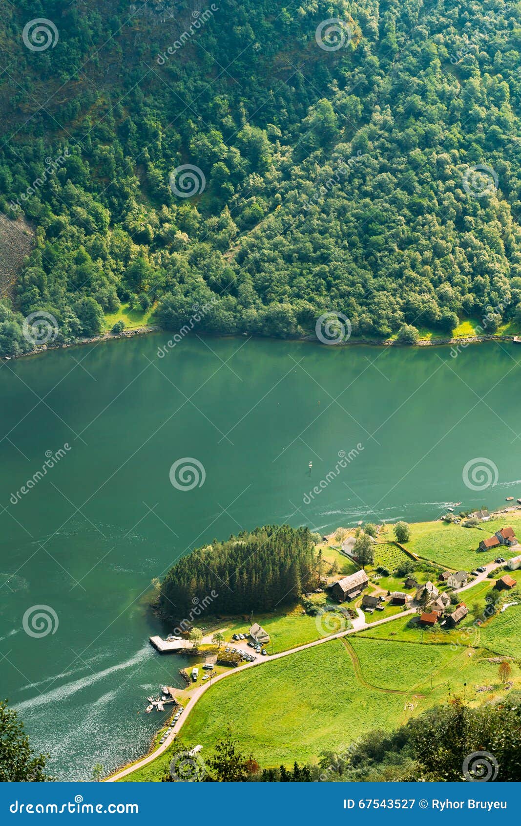 Small picturesque village near Sognefjord fjord in Norway. Amazing nature of the Norwegian mountains. Beautiful landscape. Travel concept. Scenic view from mountain top.