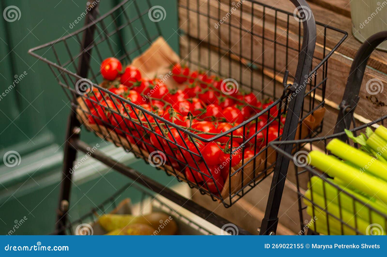 Small Red Tomatoes in Basket on the Counter of Vegetable Market Stock