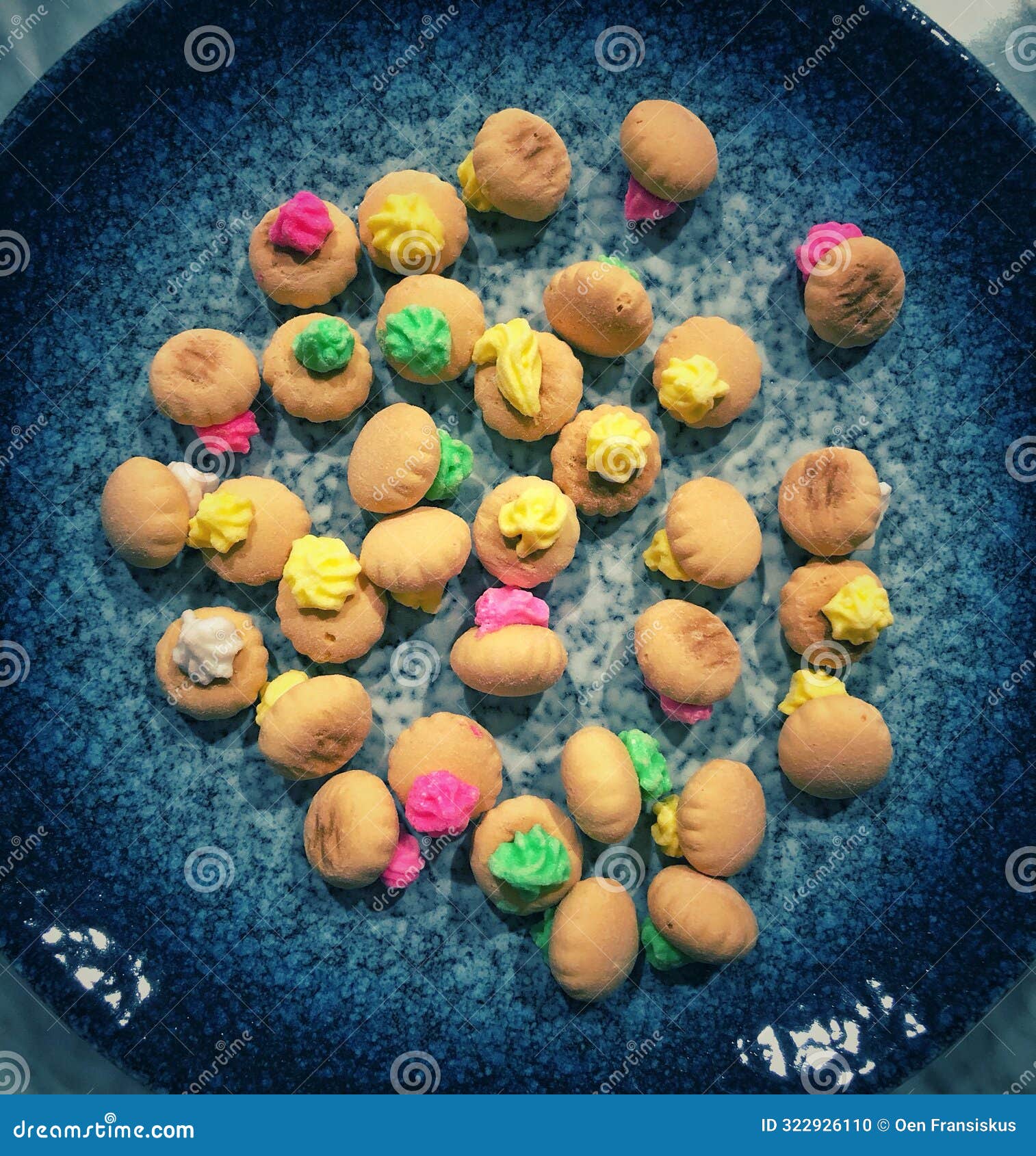 small round biscuits topped with dried sugar coating decoration in various colors