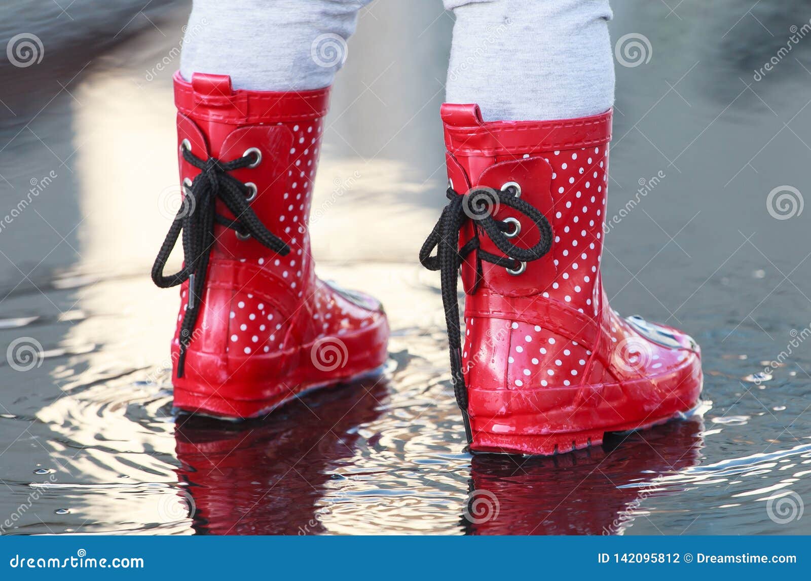 Small rubber wellies stock photo. Image of boots, puddle - 142095812