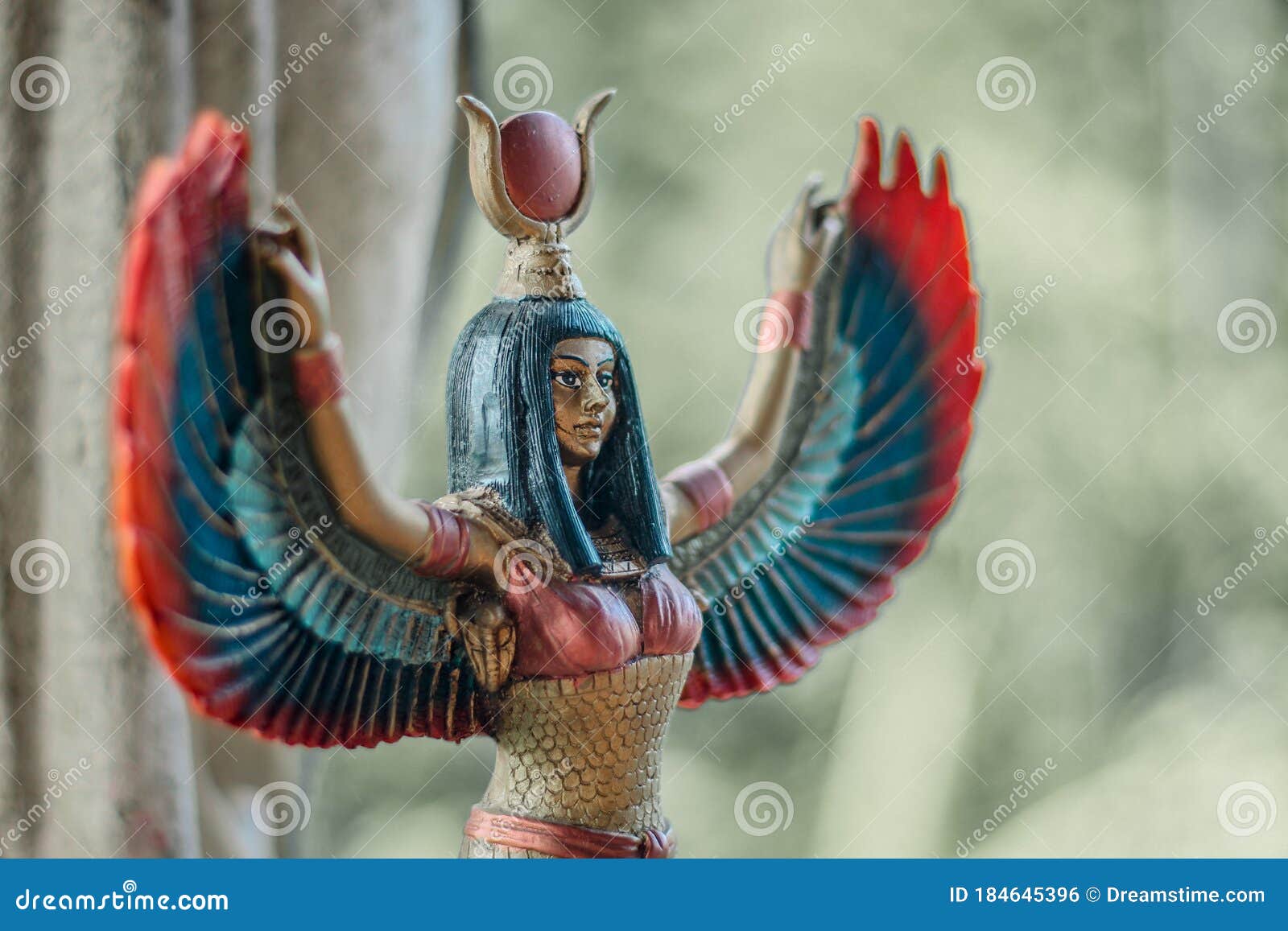small sculpture of egyptian goddess isis