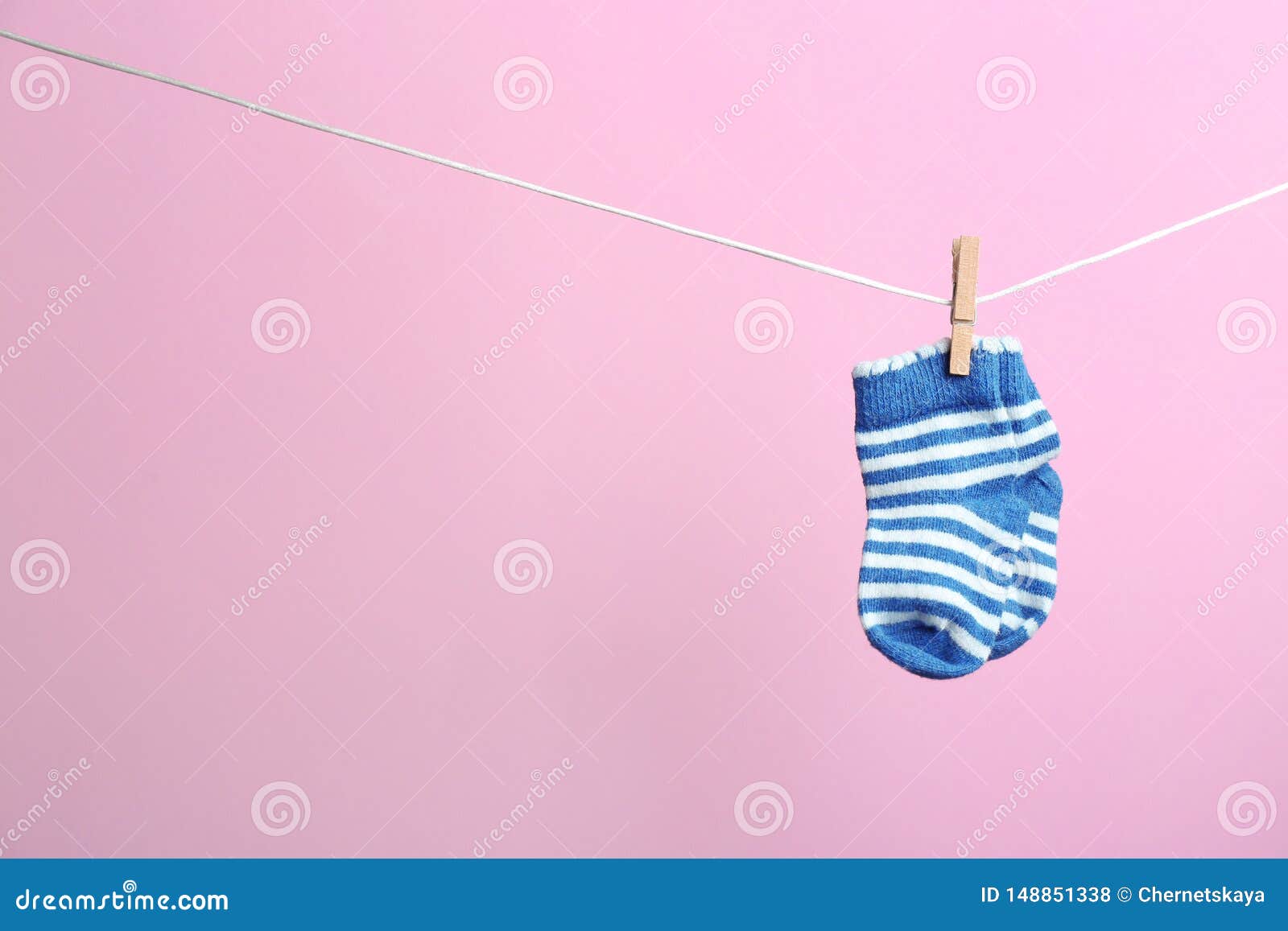 Small Socks Hanging on Washing Line, Space for Text. Baby Accessories ...