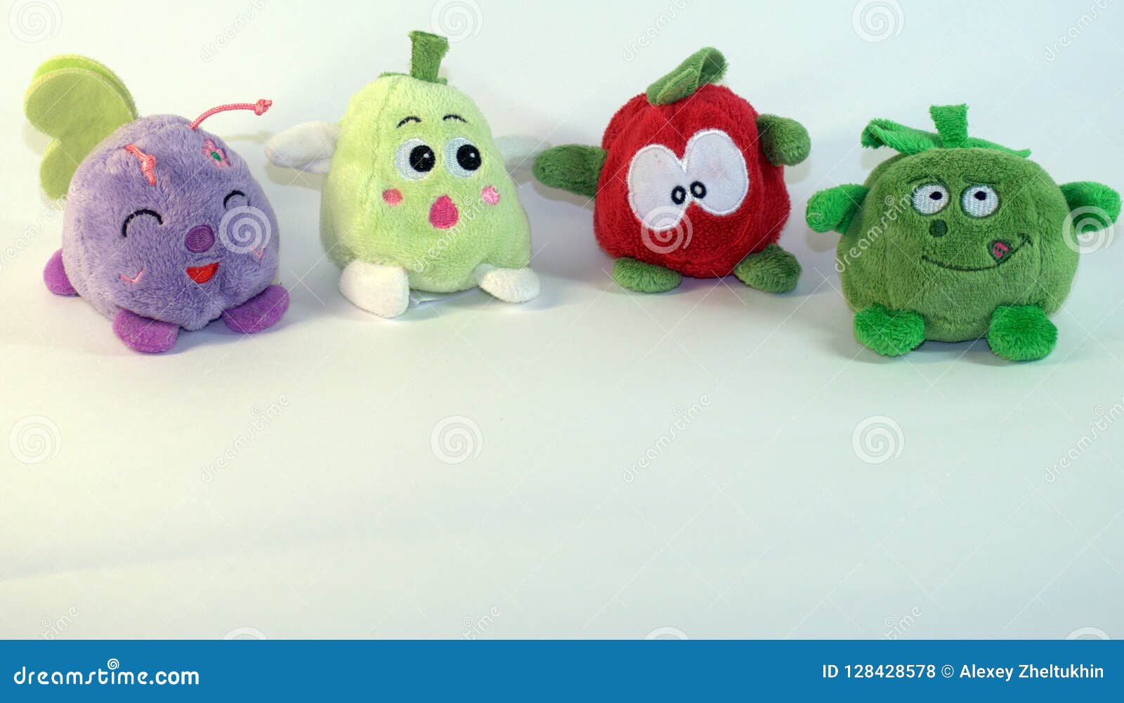 Small Soft Children`s Toys Depicting Fruits, Vegetables And A Small Fly. The Picture Was Taken