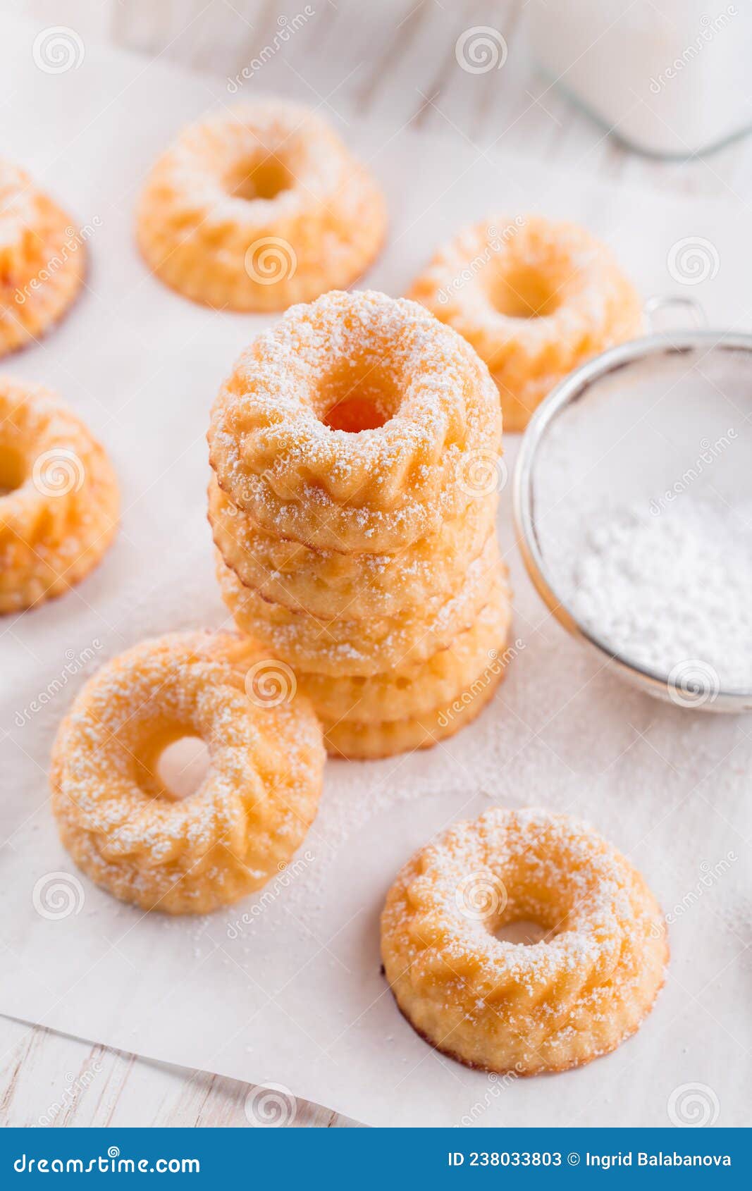 Small Sponge Cakes with Cottage Cheese. Ring Cakes on White Background