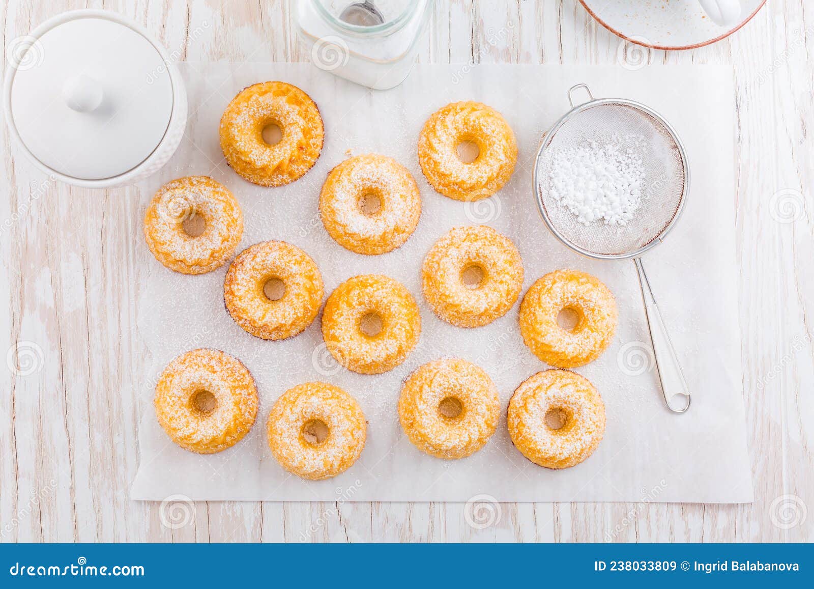 Small Sponge Cakes with Cottage Cheese. Ring Cakes on White Background