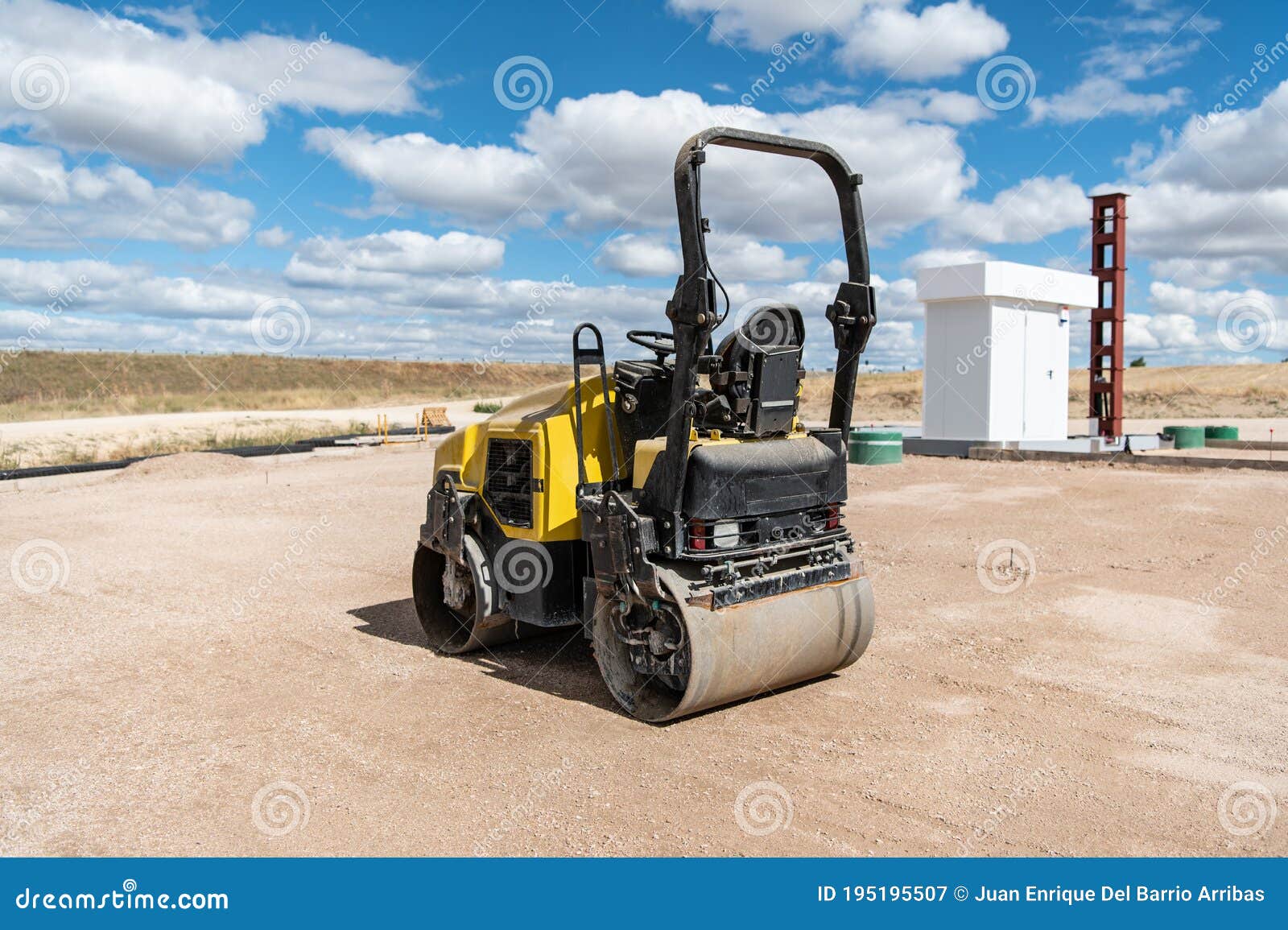 Small Steamroller at a Construction Site, Leveling the Ground Stock