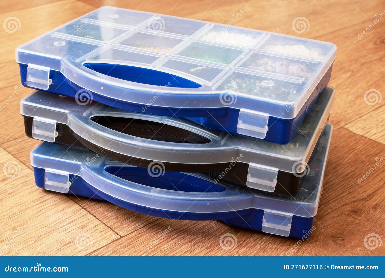 Small Storage Containers on a Wooden Floor Stock Photo Image of clean