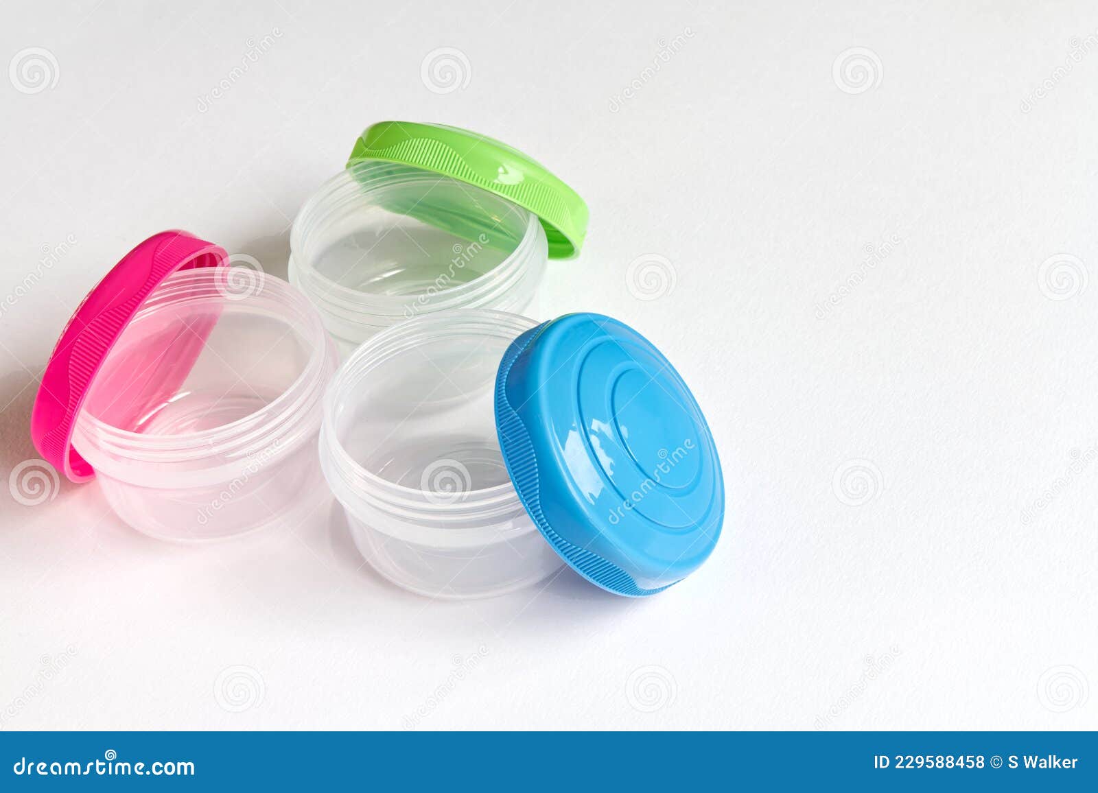 Small Storage Tubs, with Brightly Coloured Lids on White