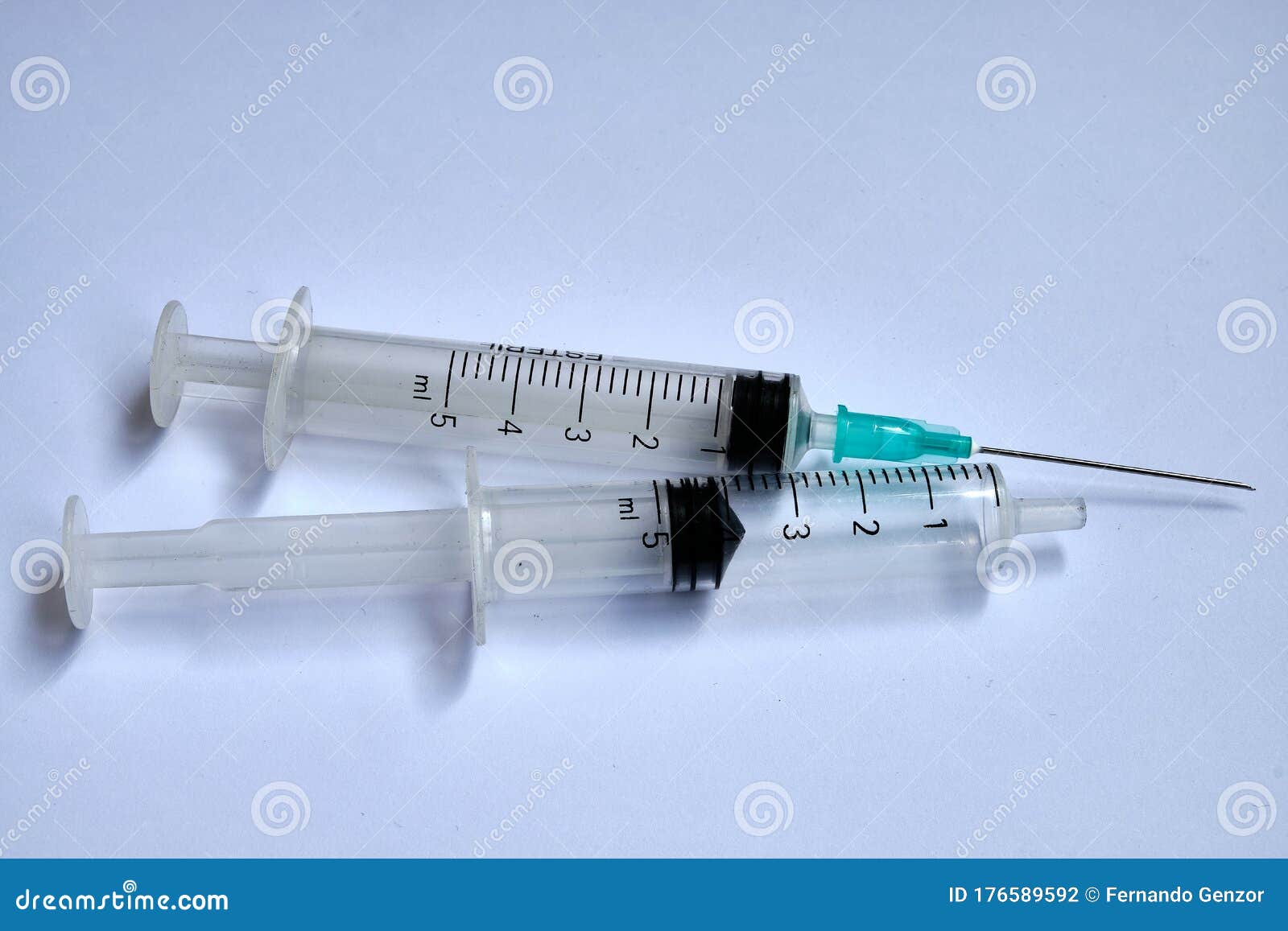 A Small Syringe into Which a Hollow, Sharppointed Bevelcut Needle is