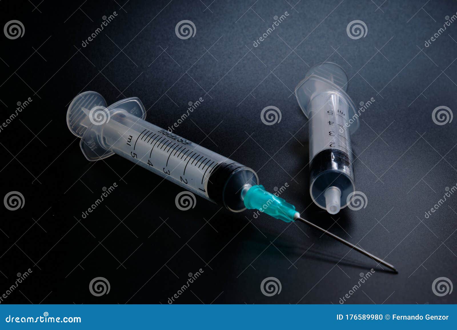 A Small Syringe into Which a Hollow, Sharppointed Bevelcut Needle is