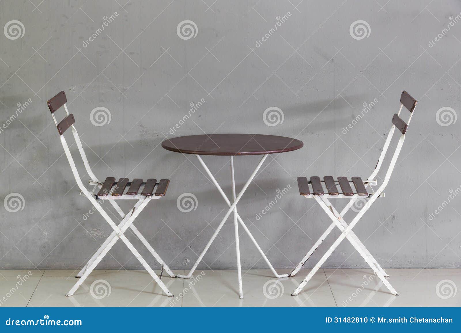Small Table and Chairs Near Grunge Wall Stock Photo Image of wood
