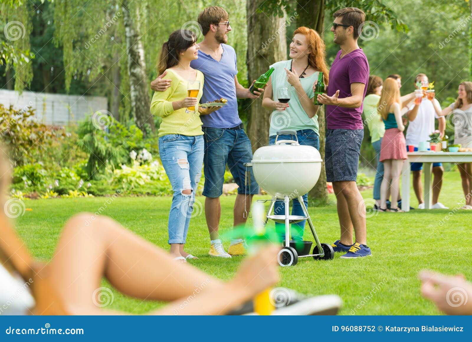 Small talk at grill party stock photo. Image of sunbed 96088752
