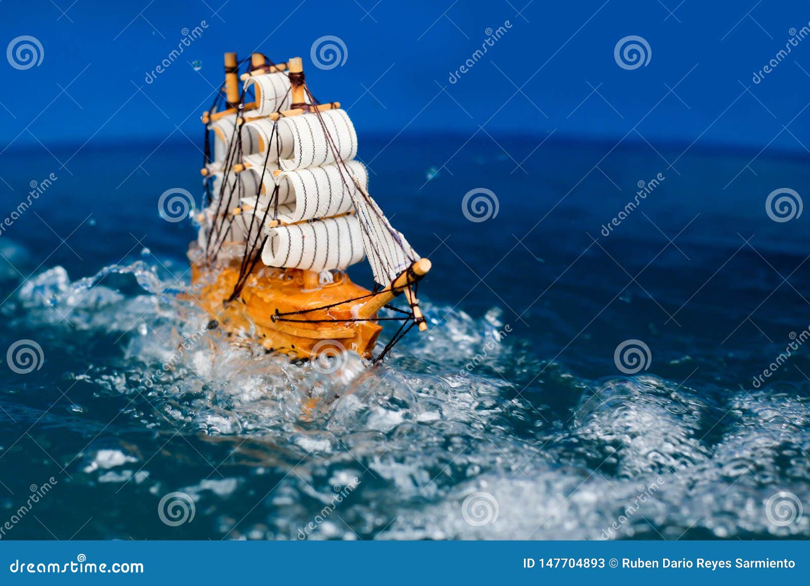 Small Toy Boat In The Water With Big Waves White Wooden 